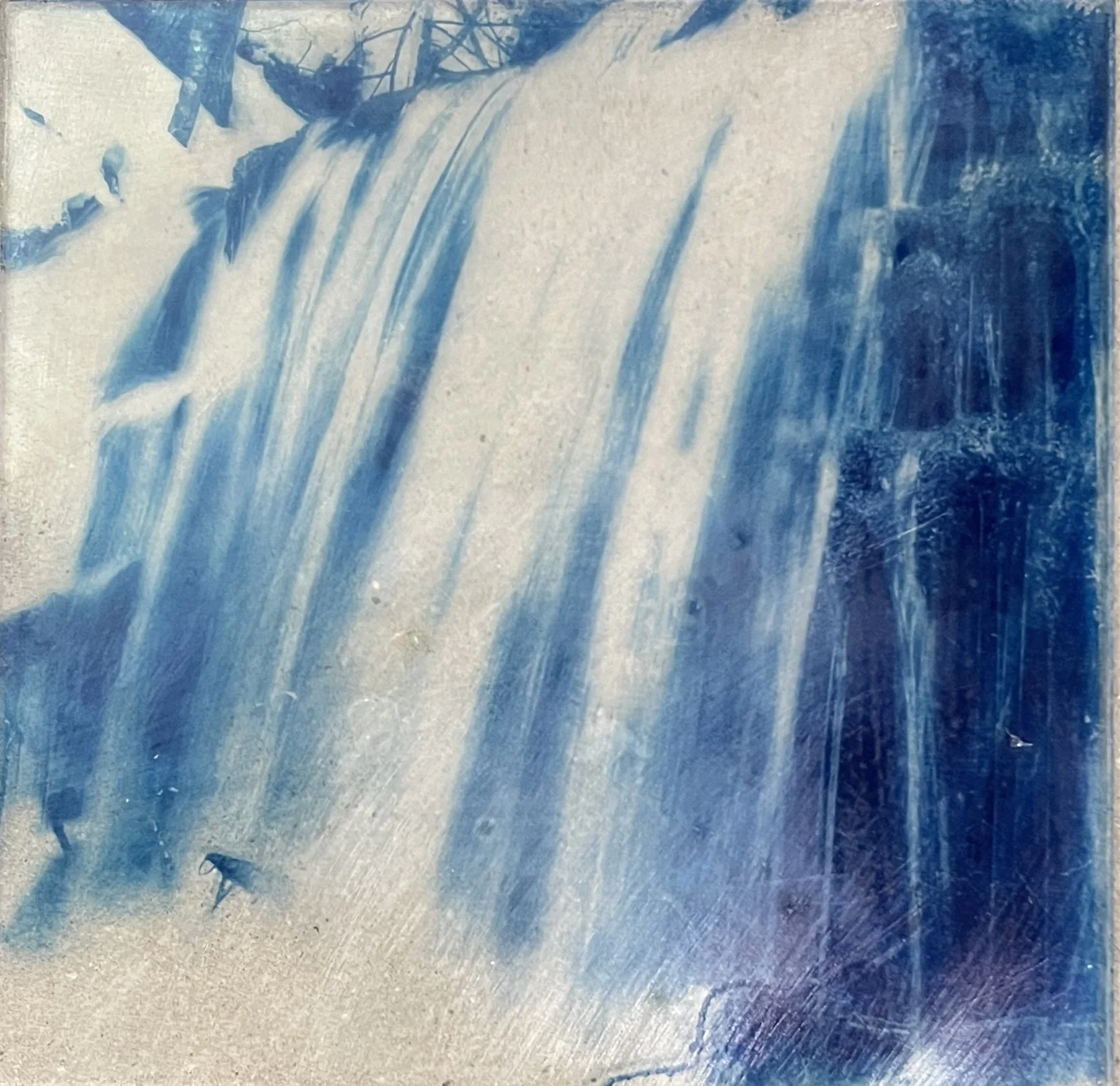 Abstract blue and white painting with streaks and textures.