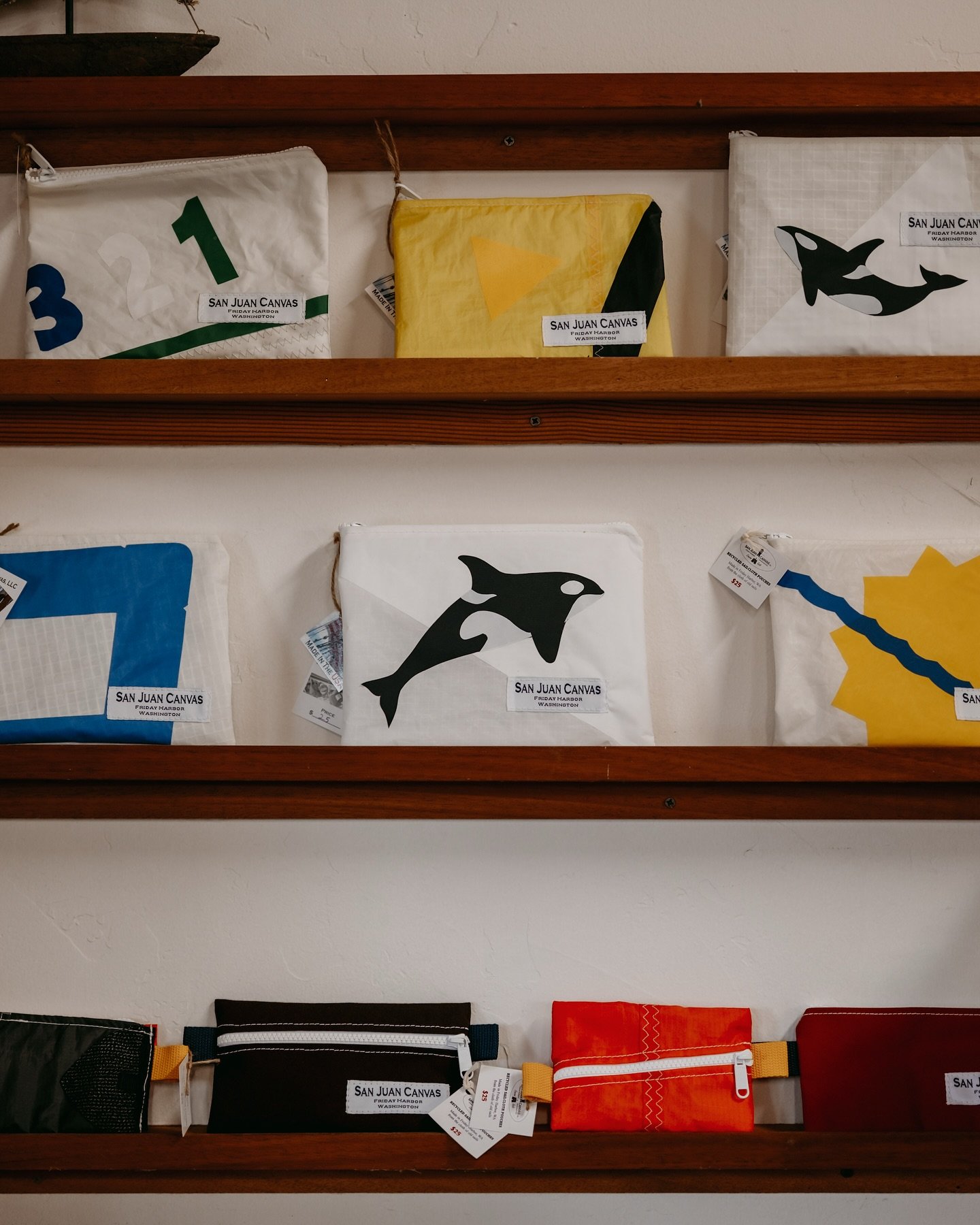 A wall full of our popular recycled sailcloth pouches. All made by hand in our shop on the water in Friday Harbor, WA. Our pouches make great stocking stuffers or the perfect small (but mighty) gift!