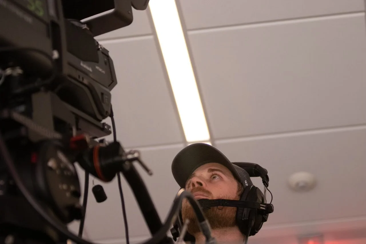 Valente on set with a camera