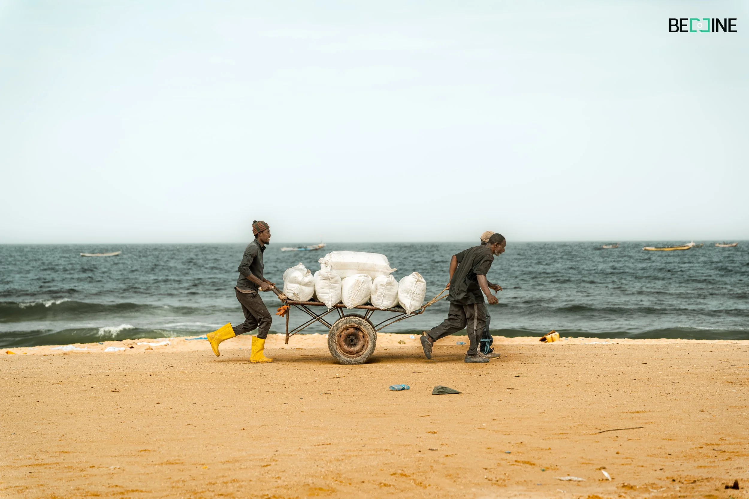 men of sea dragging cart (1 of 1).jpg
