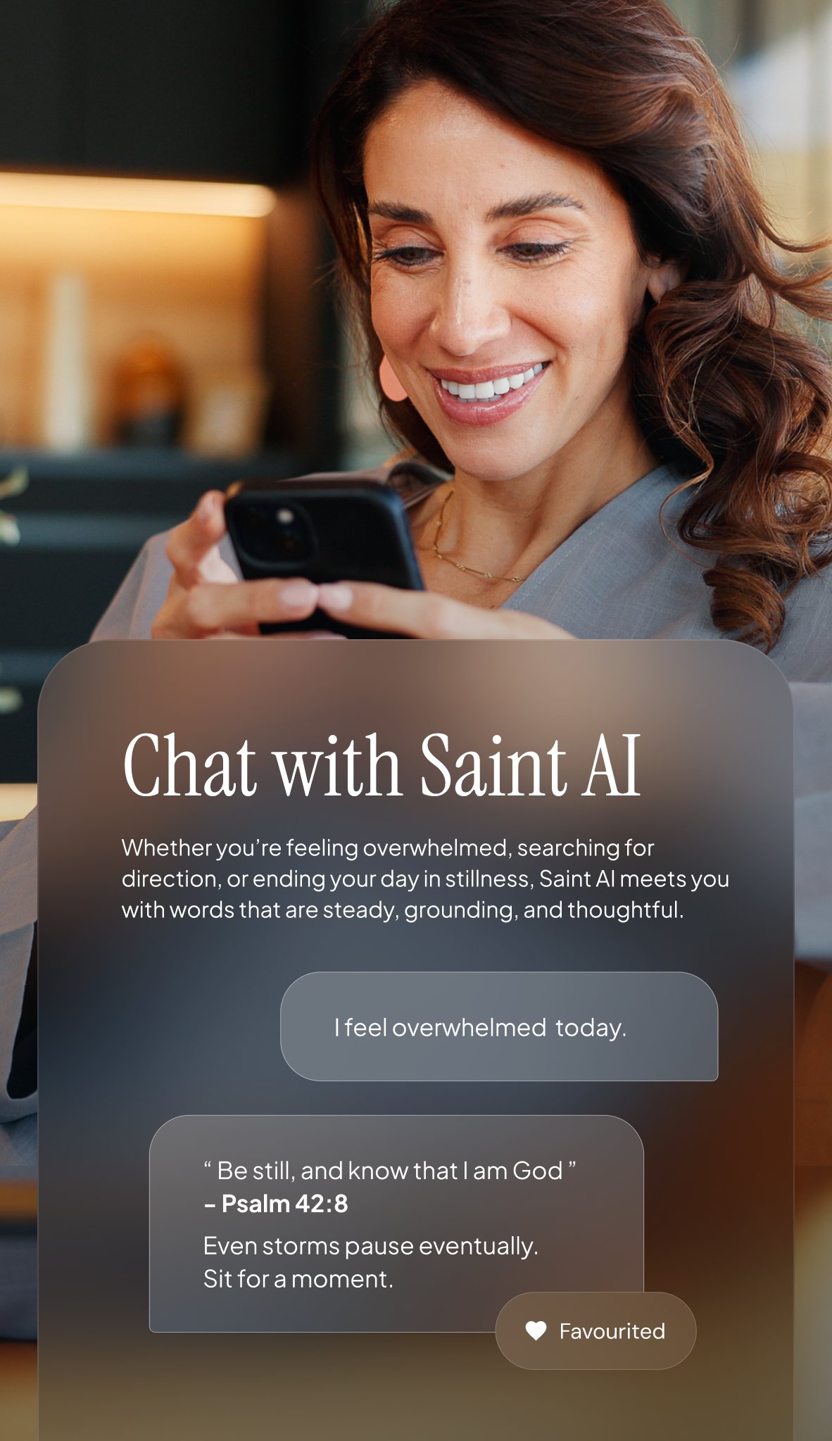 A woman with brown hair smiling while looking at her phone in a cozy indoor setting.