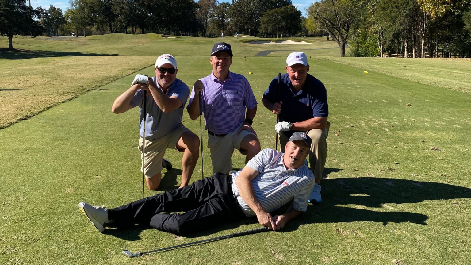 Golf tournament participants pose together on the course during the B.D. Rodgers Memorial Golf Tournament supporting Crittenton.