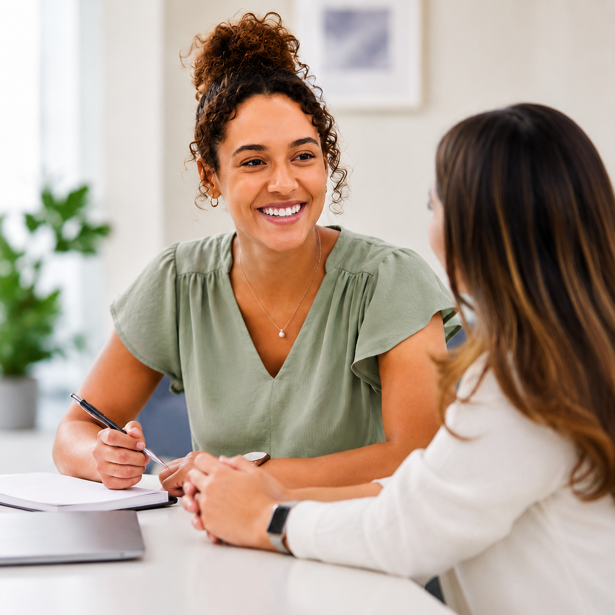 Two staff members meet together, representing Crittenton's family-friendly and supportive workplace culture.