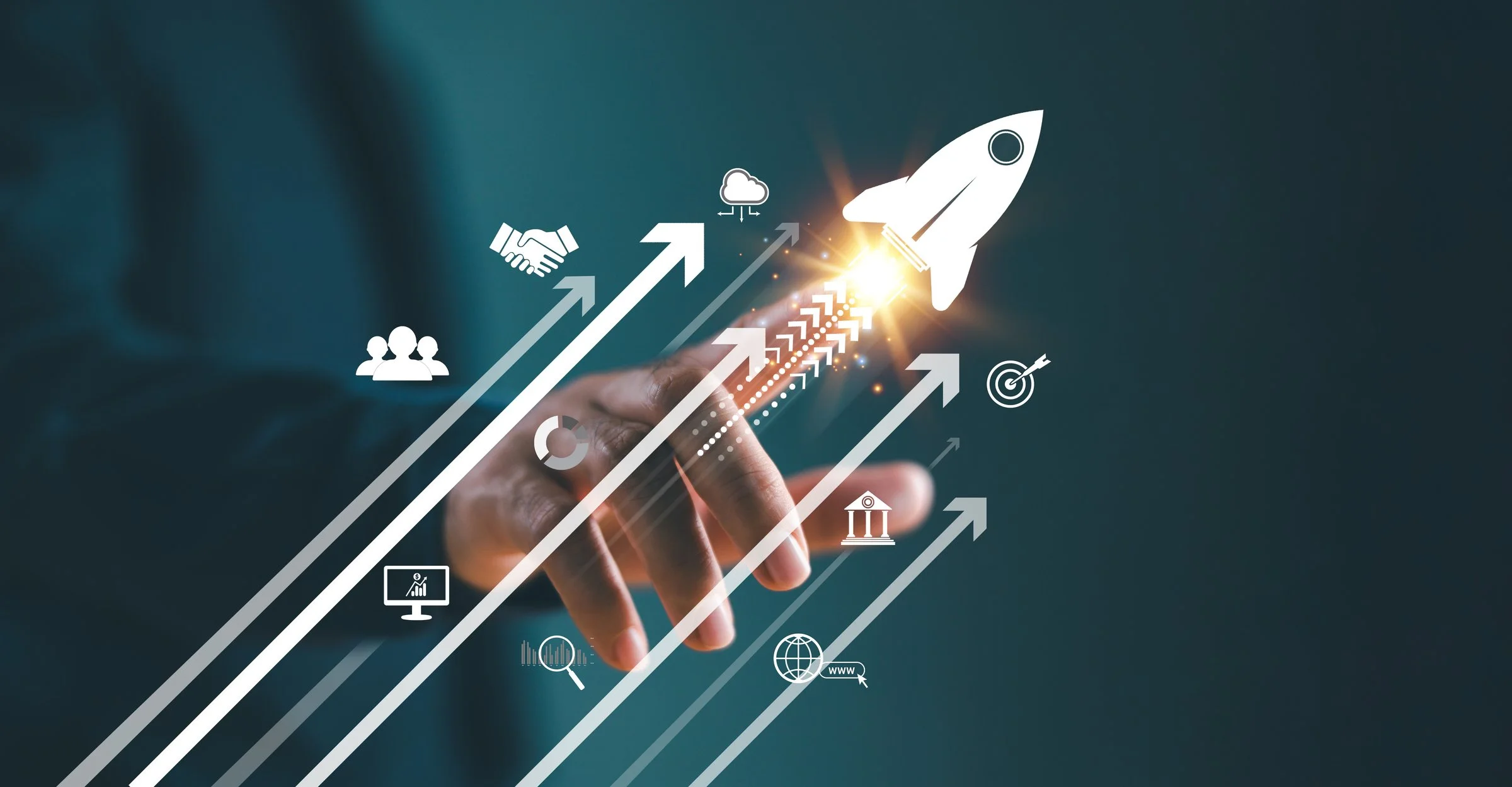 Hand pointing with digital icons and arrows indicating growth and progress, including a rocket symbolizing startup success or business launch.