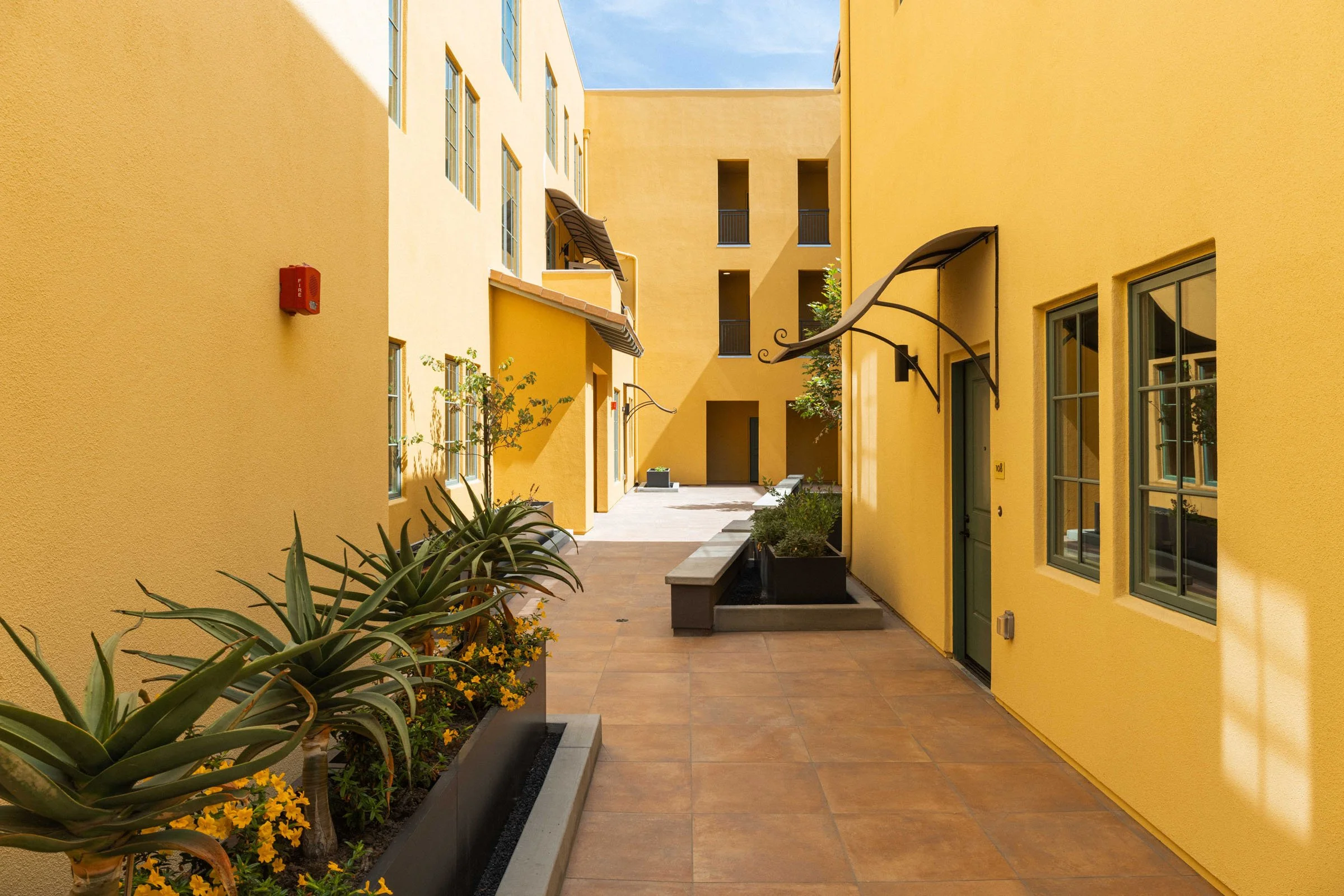 Planted walkways and landscaped courtyards at Walnut Crossing Pasadena