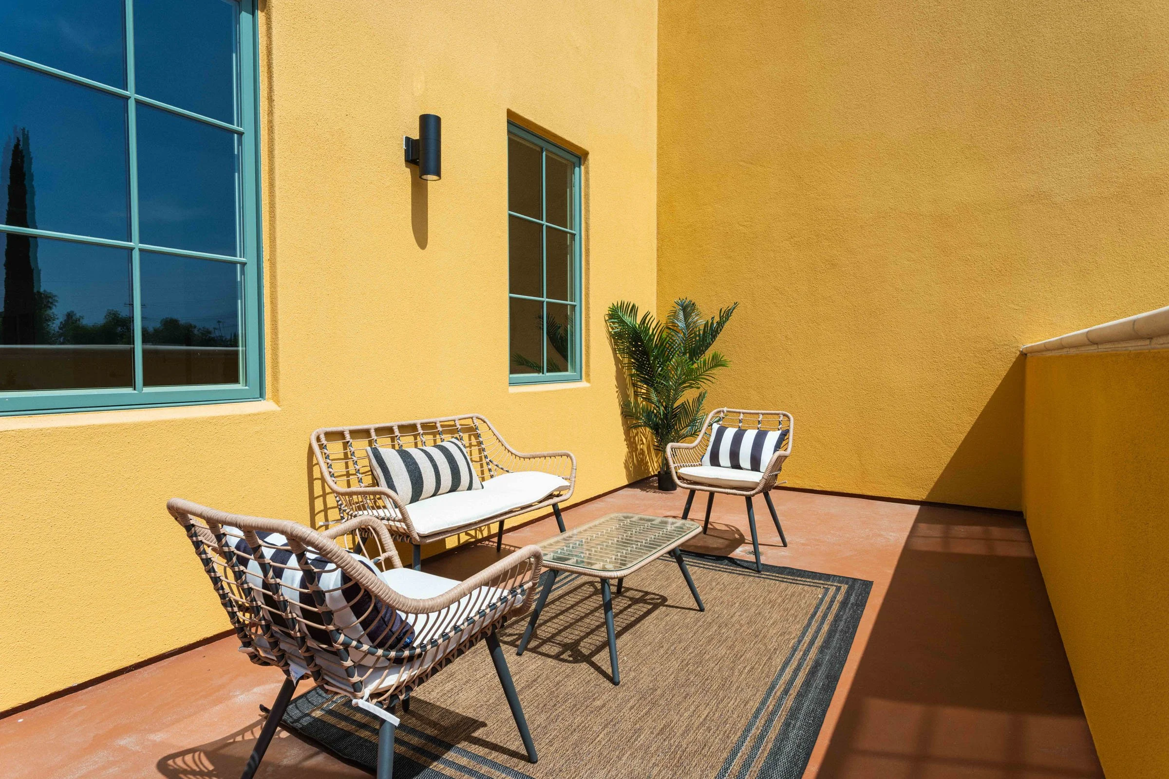 Private balcony with outdoor seating at Walnut Crossing Pasadena