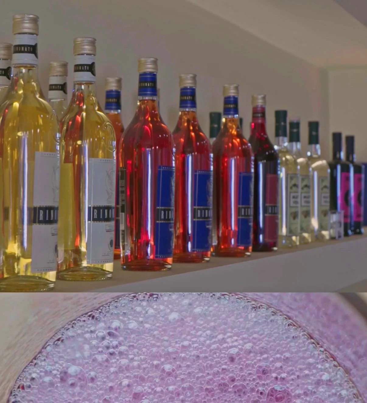 Shelf of colorful bottles of alcohol and a close-up of a pink, bubbly beverage.