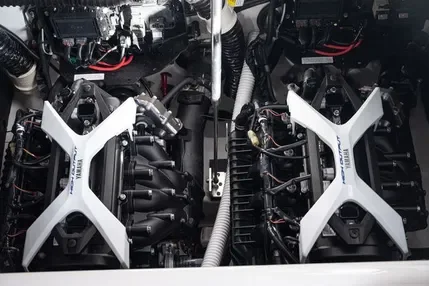 Close-up of a dual-engine aircraft or drone engine compartment with visible mechanical components and wiring.