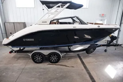 A Yamaha motorboat on a trailer inside a warehouse