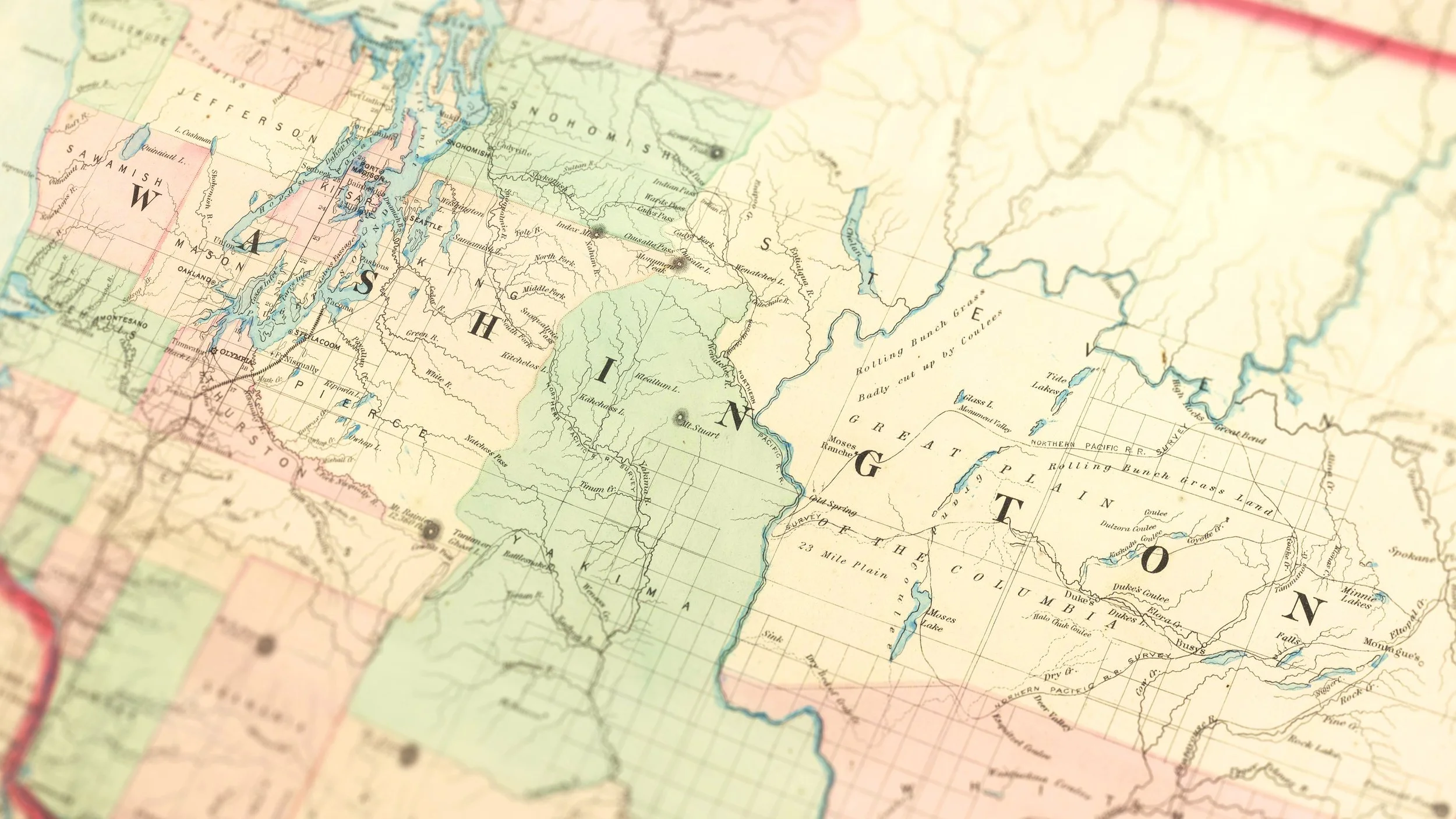A vintage map of the northwestern United States, including Washington, Oregon, Idaho, and parts of surrounding states, showing mountains, rivers, and geographical features.
