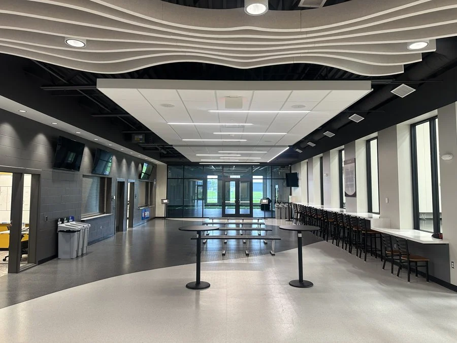 Interior lobby and gathering area at Hasse Ryt-Way Arena in Northfield, Minnesota, featuring an integrated multi-zone audio system designed by EPA Audio Visual.