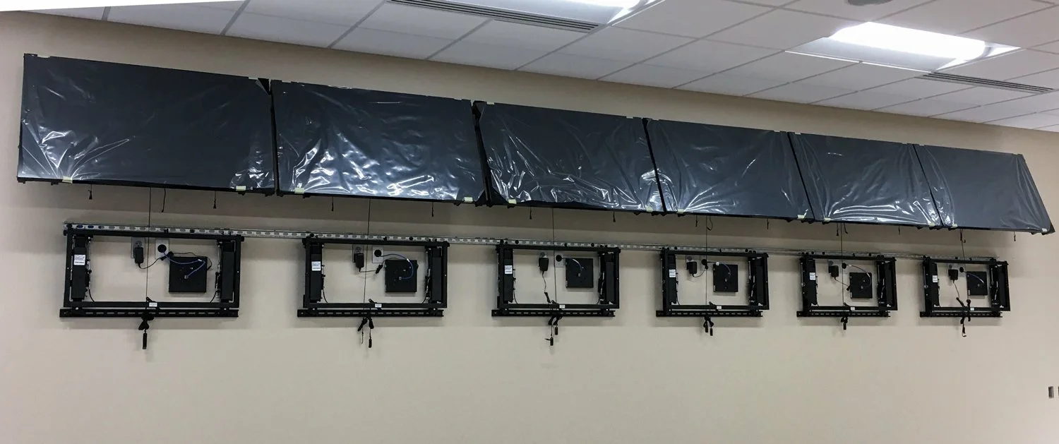 Installation of a large multi-screen video wall and mounting system at the Crow Wing County emergency dispatch center.