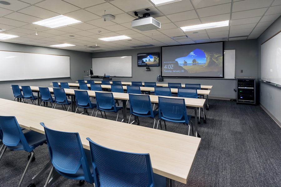 Classroom at Concordia College Integrated Science Center featuring ceiling-mounted projection, presentation displays, and integrated audiovisual technology.