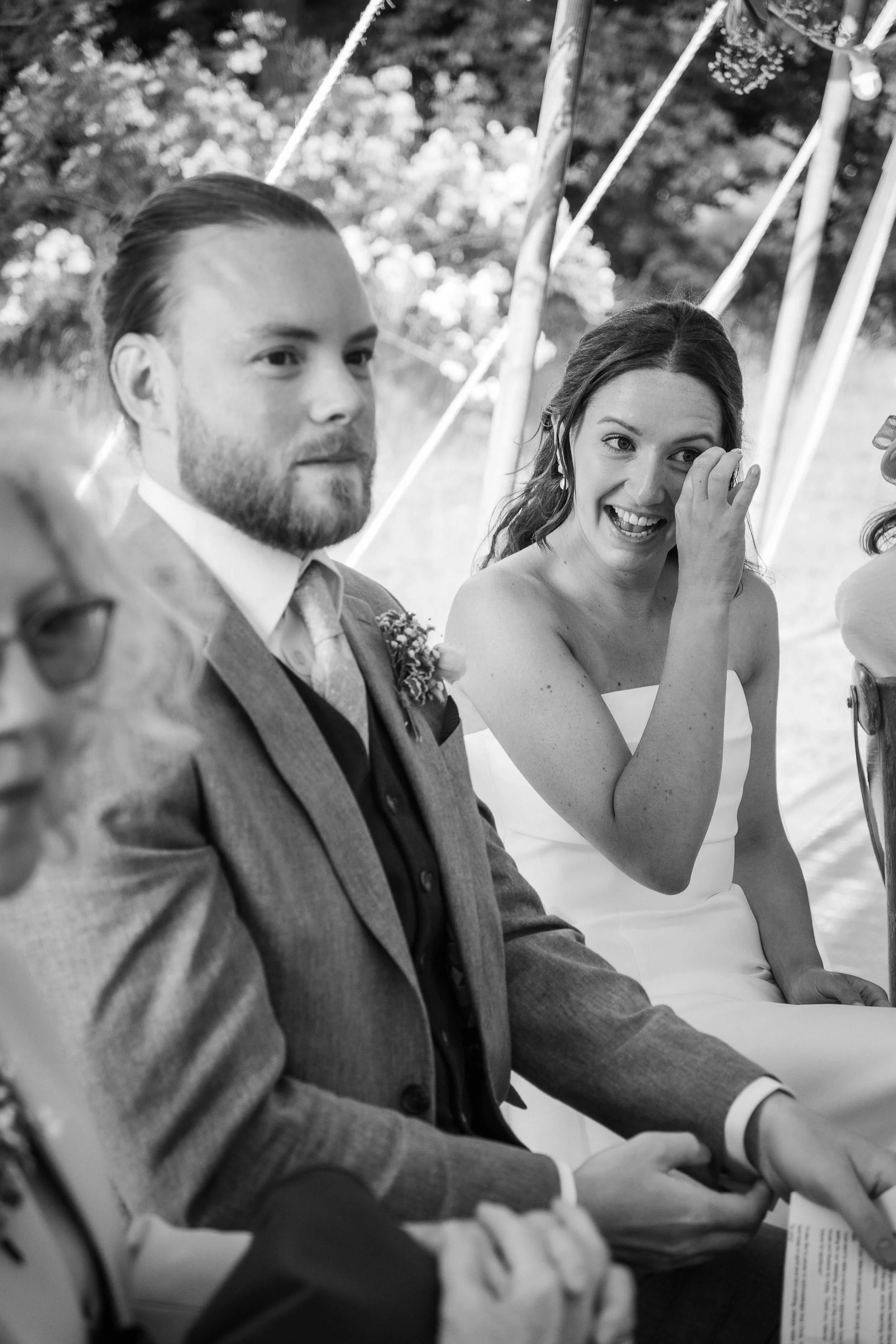 Emotional black and white wedding candid