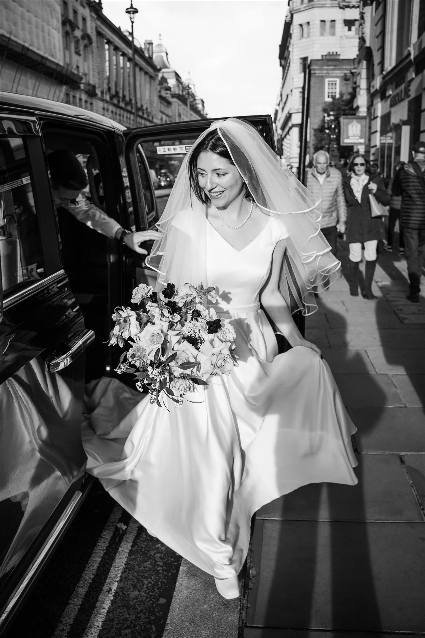 City bridal portrait with vintage taxi

