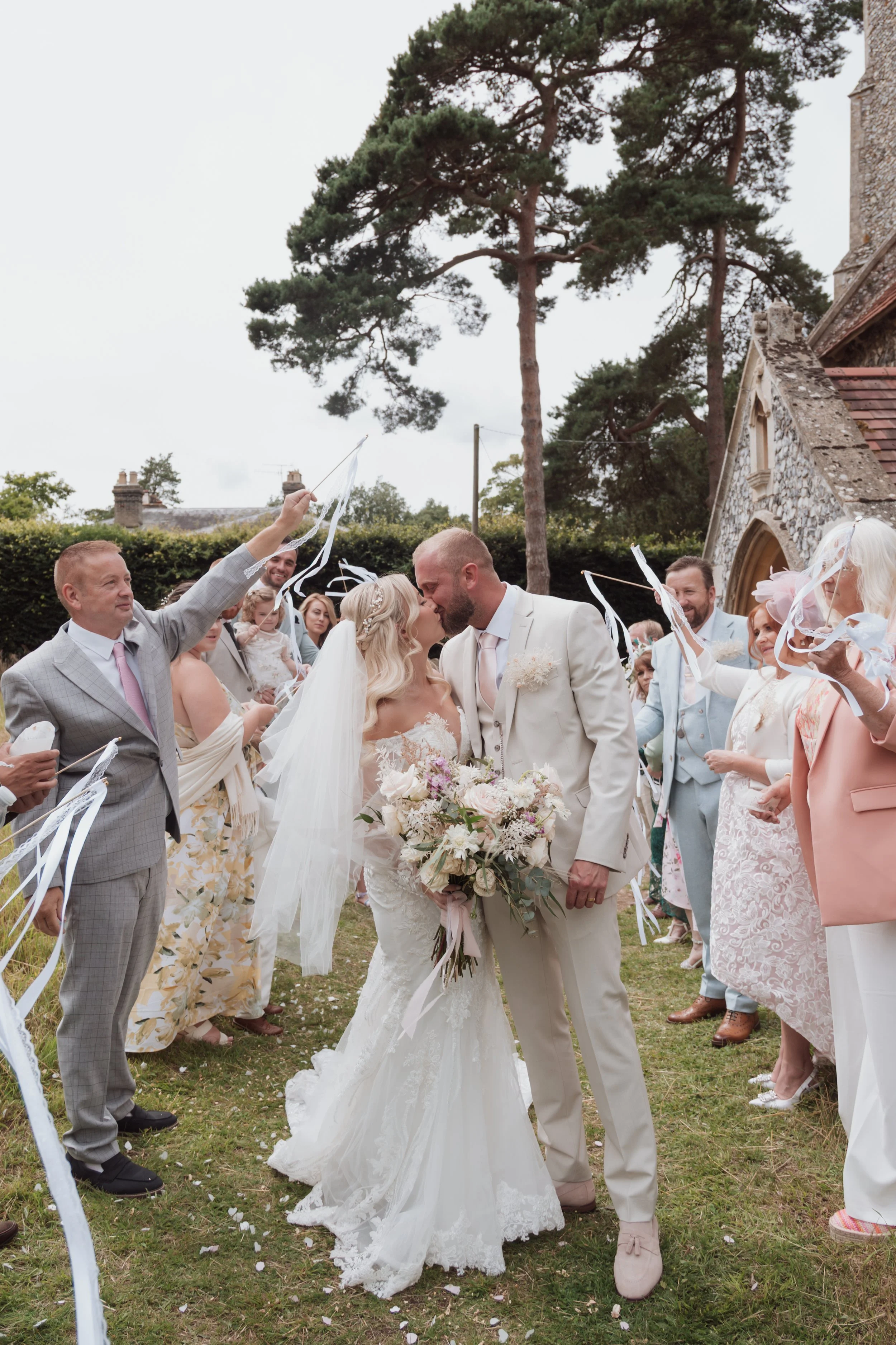 Outdoor wedding ceremony kiss celebration
