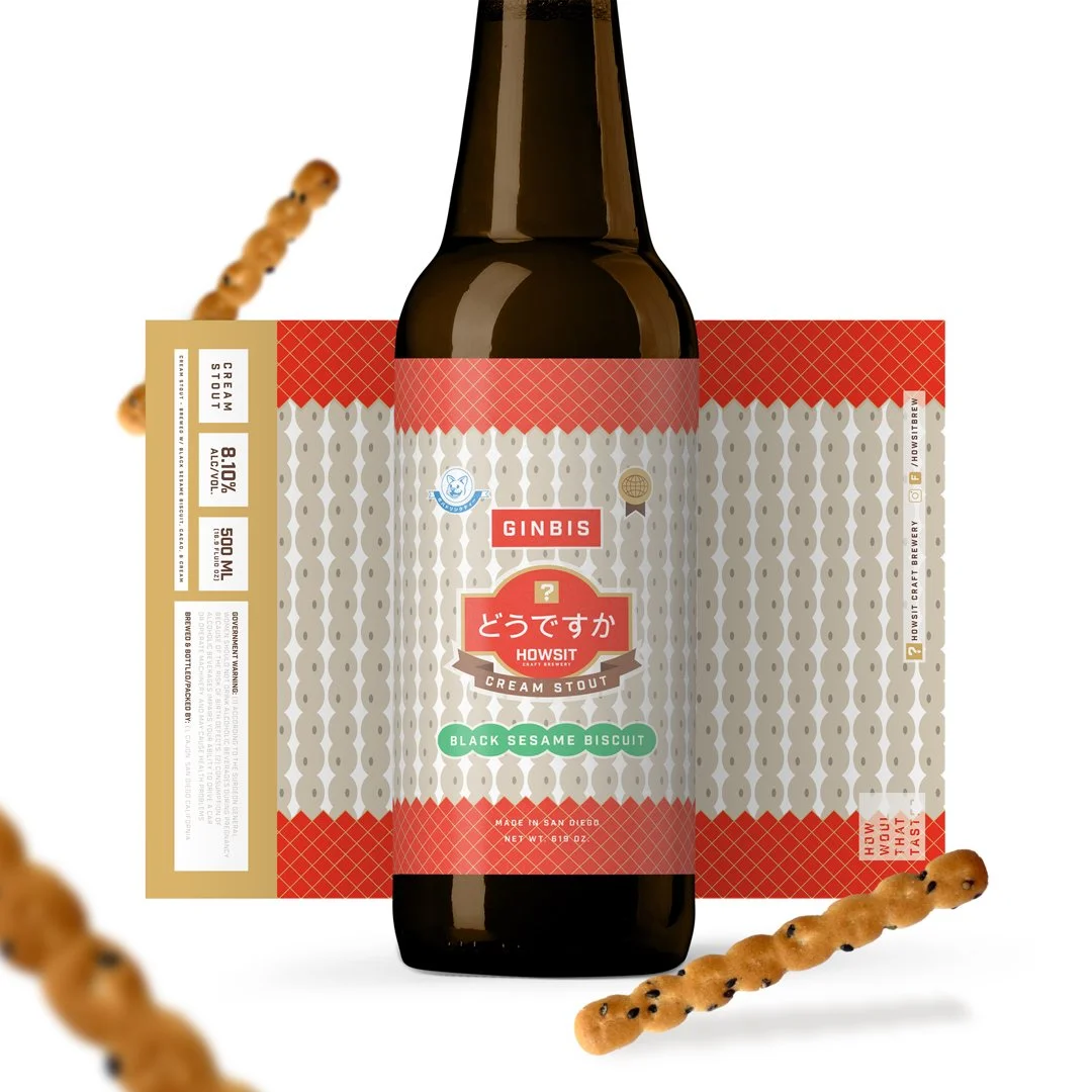A bottle of Ginbis cream stout beer with Japanese text on the label, surrounded by two sesame biscuit snacks with sesame seeds and black sesame seeds on a white background.