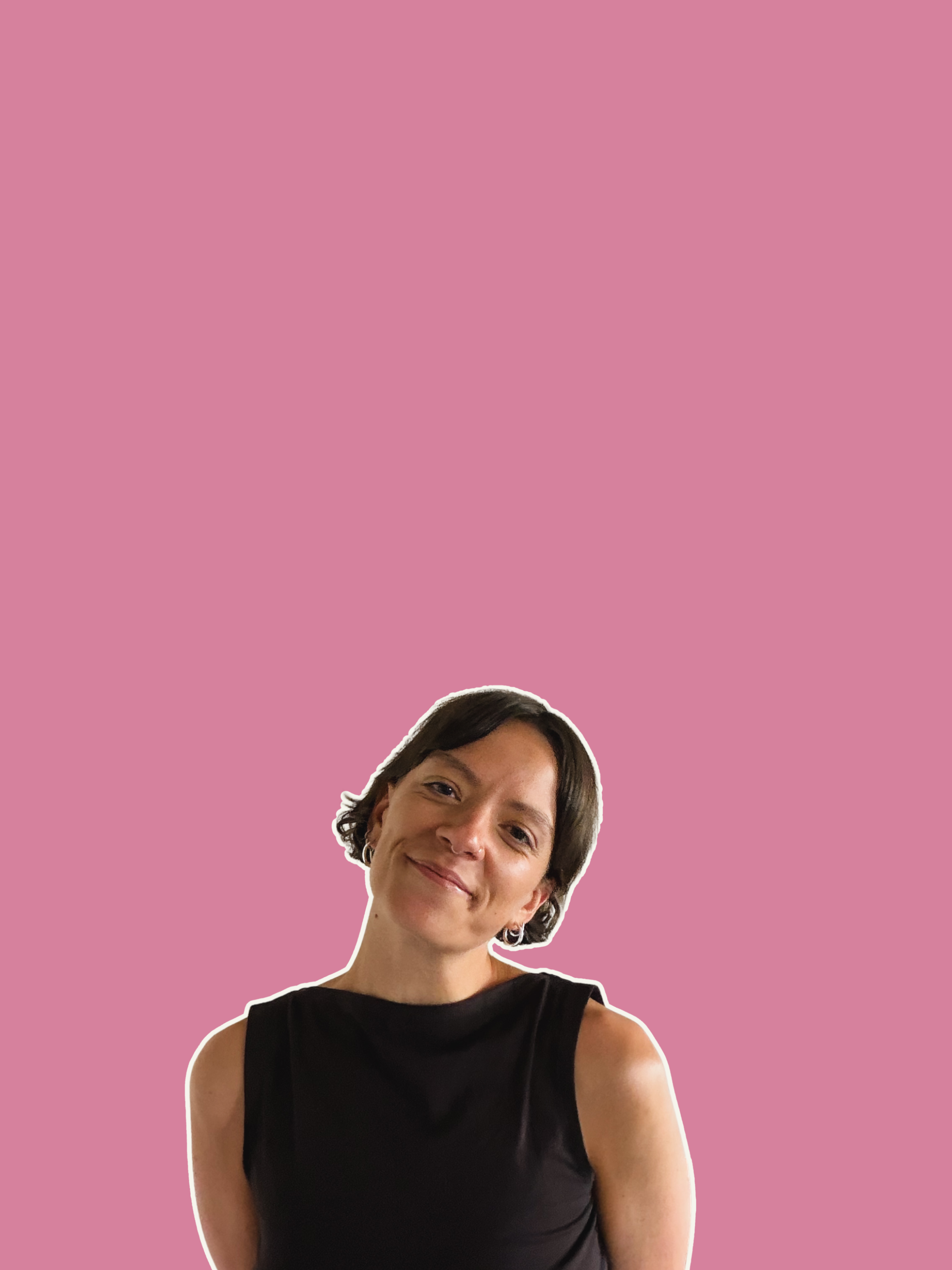 A warm, smiling woman with short brown hair, wearing a black sleeveless top, against a pink background.