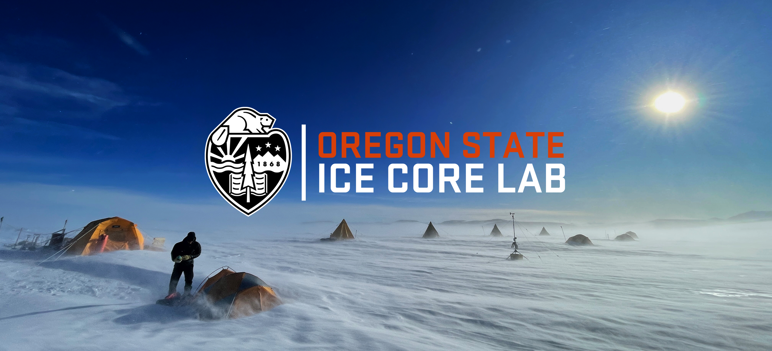 The logo for the ice core lab, set against a photo of one of our Antarctic field camps.