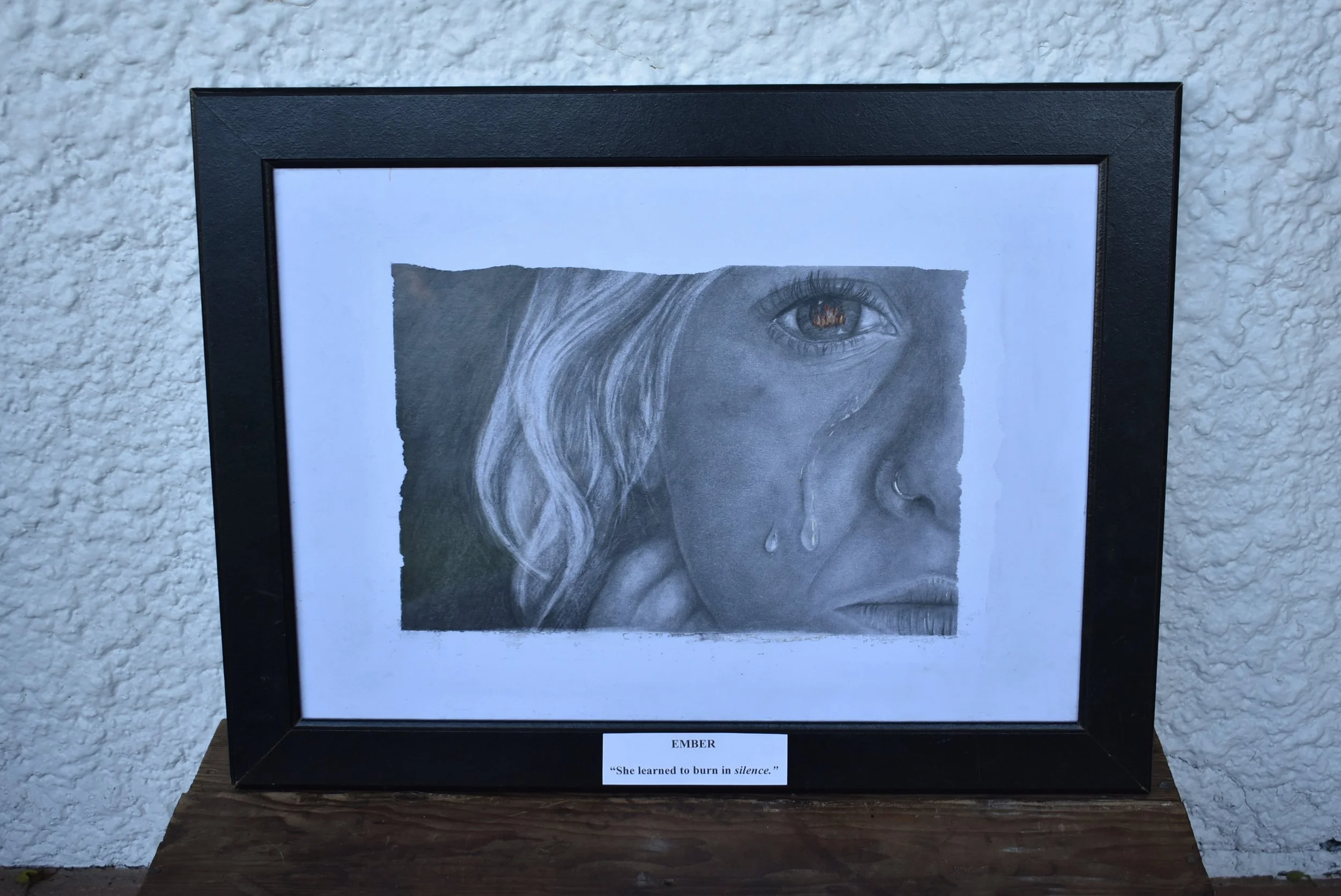 EMBER - “She learned to burn in silence”