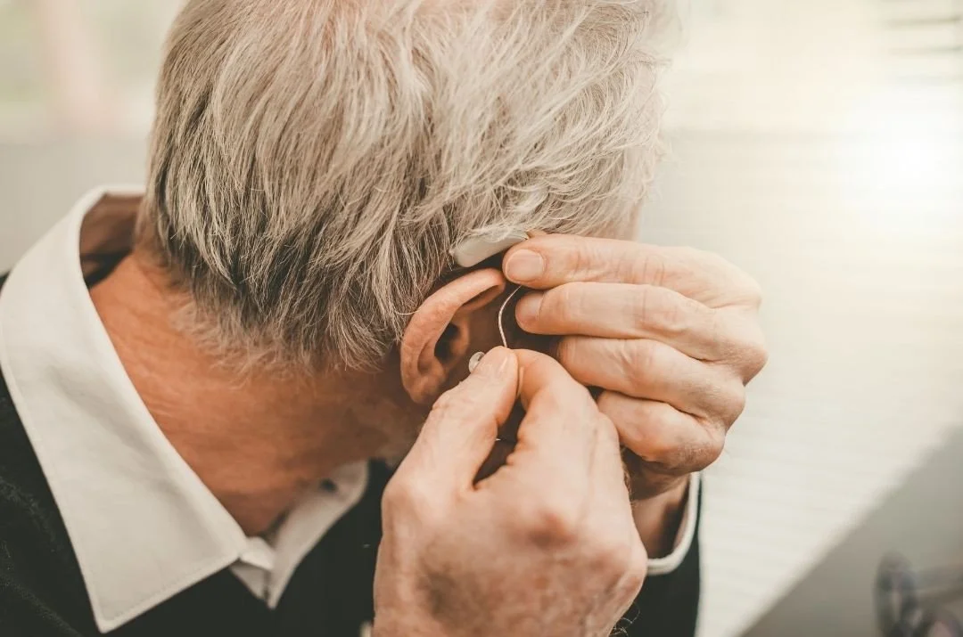 Hearing aid illustrating ear care and ear wax management for hearing aid users.