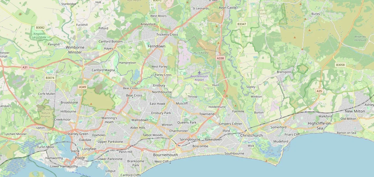 A detailed map of Bournemouth, Christchurch, Poole and surrounding areas in southern England, showing roads, towns, and geographical features.