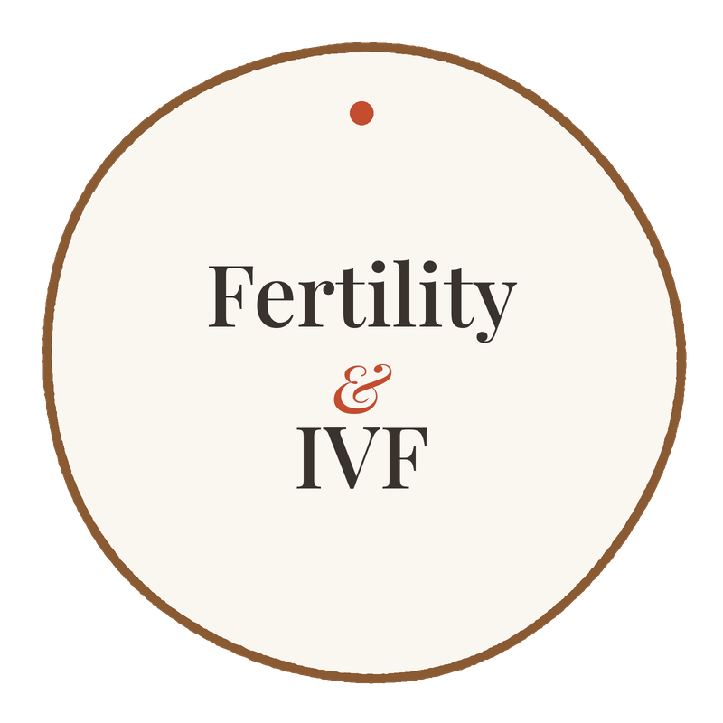 A round sign with the words 'Fertility & IVF' written in the center.