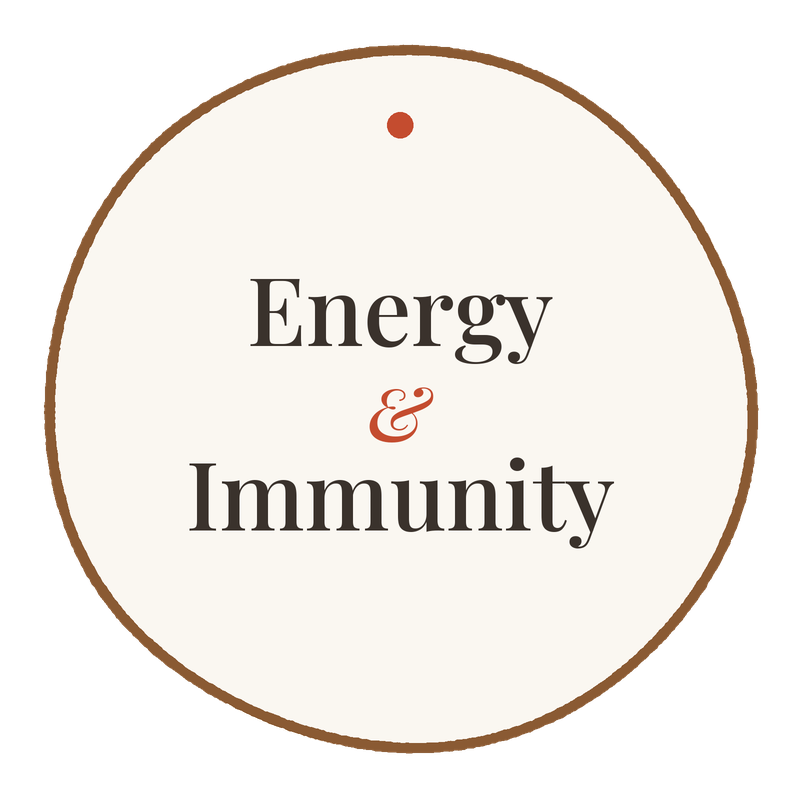 A circular emblem with a beige background and brown border, displaying the words "Energy & Immunity" in black text, with an orange ampersand.