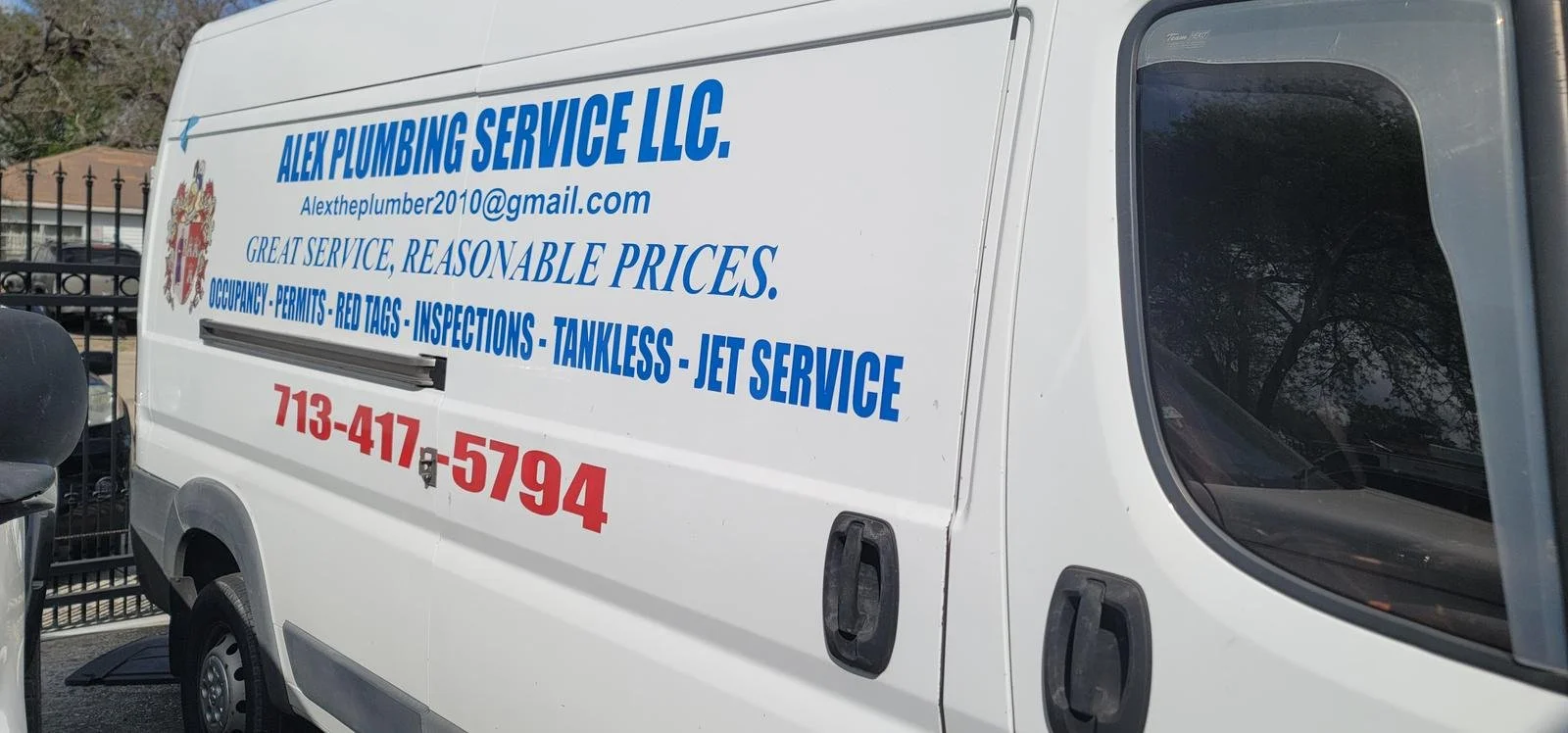 White plumbing service van with blue and red text advertising Alex Plumbing Service LLC, including email and phone number, and services offered.