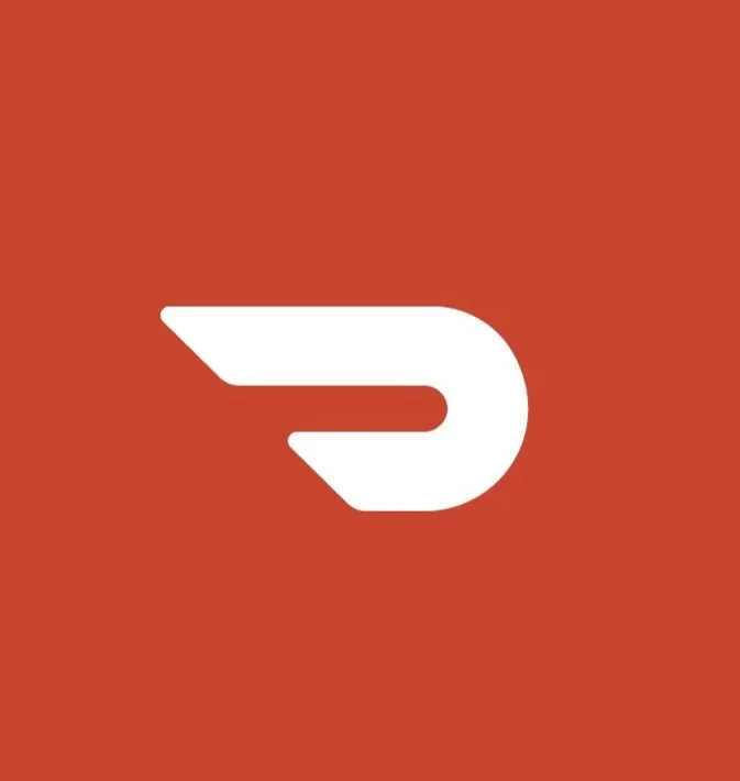 A white icon resembling a stylized letter 'D' with a wing on the left side, set against a red background.