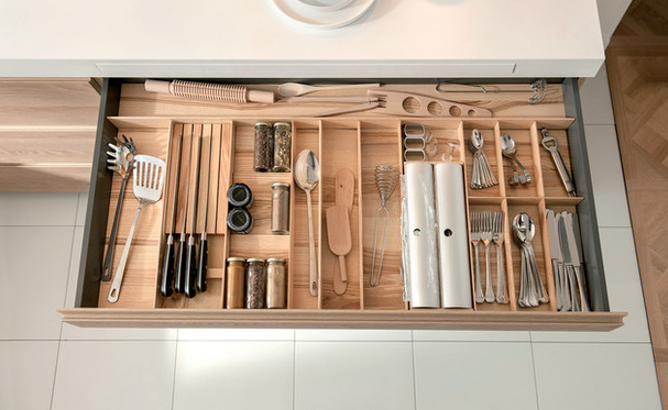 What a perfect use for that skinny shallow drawer! &nbsp;Adding the right separators maximizes it's space and eliminate the junk drawer where things go to die.