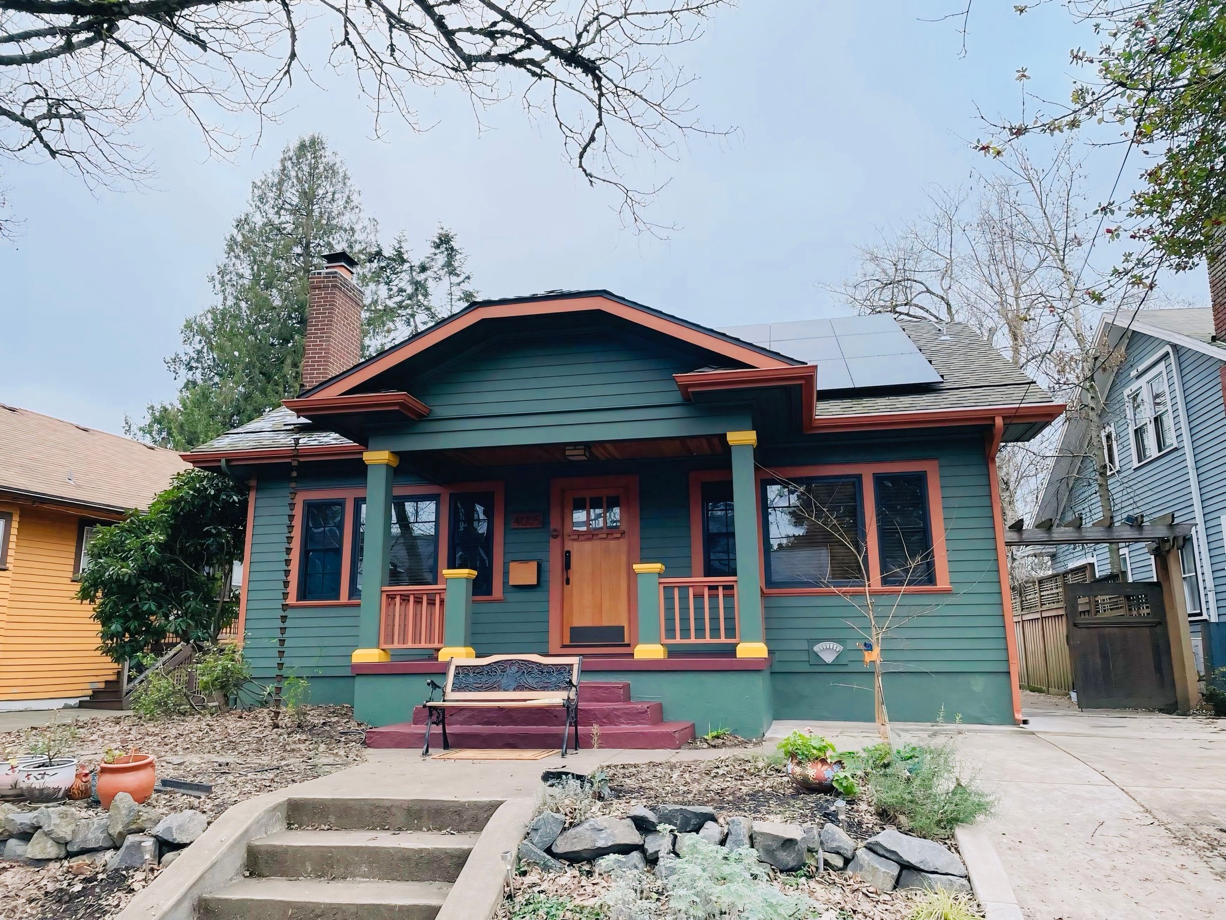 Beaverton home with custom blue and red exterior paint and detailed porch work by Cascade Painting