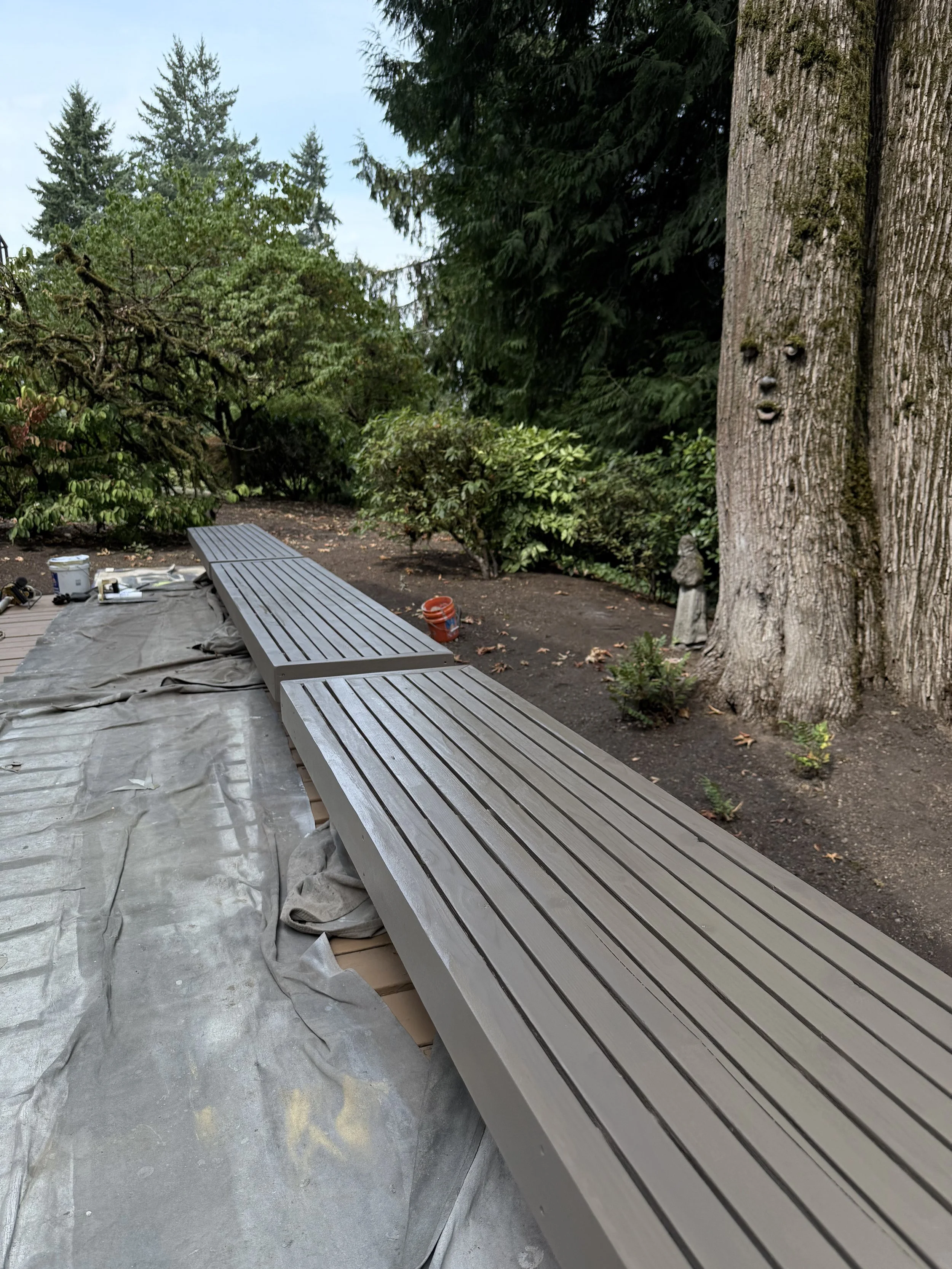 Freshly stained gray wooden bench and exterior staining project in the Westside Portland area by Cascade Painting