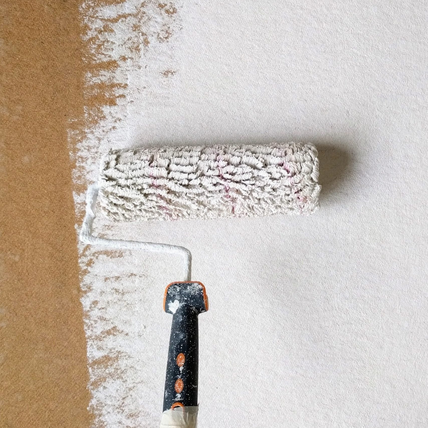Cascade Painting professional applying interior wall paint on a Beaverton residential project