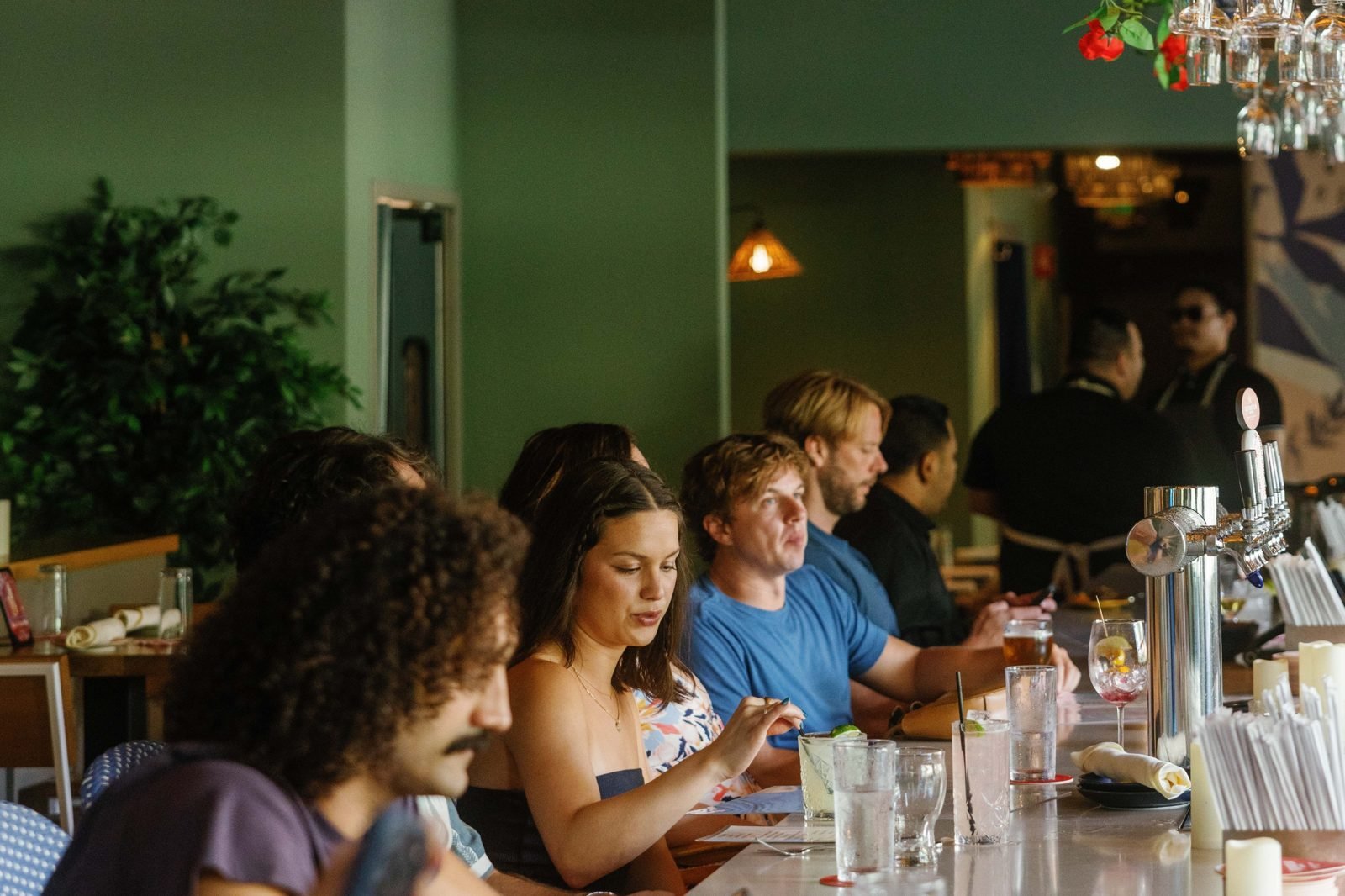 Guests dining at the bar of an Atlanta restaurant