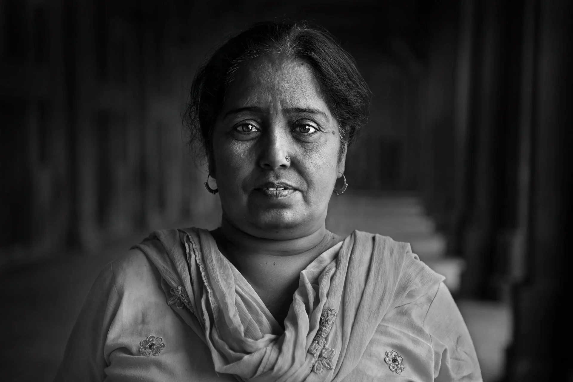 Close-up portrait of an Indian woman in the street, India 