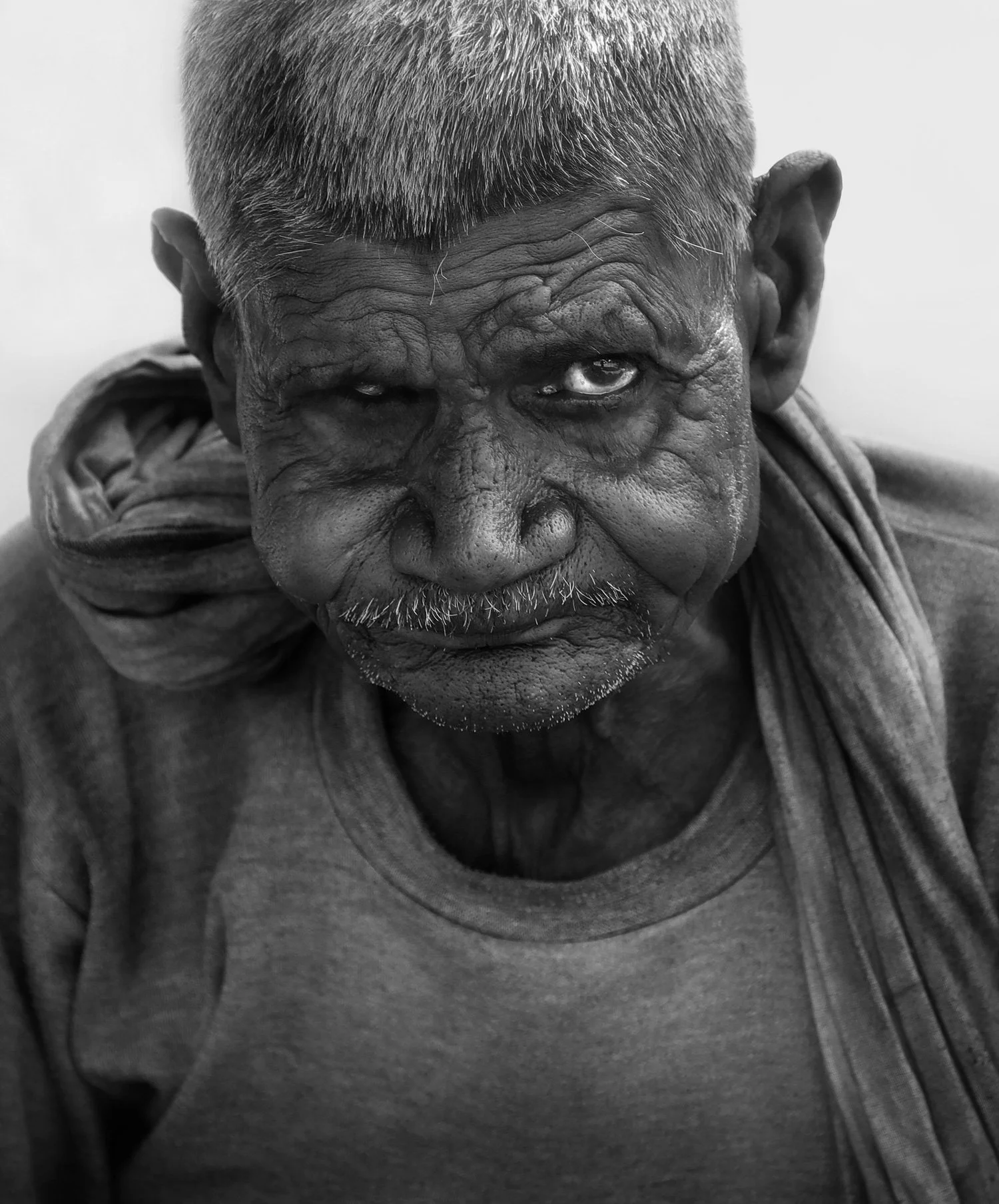 Close-up portrait of an Indian man in the street, India 