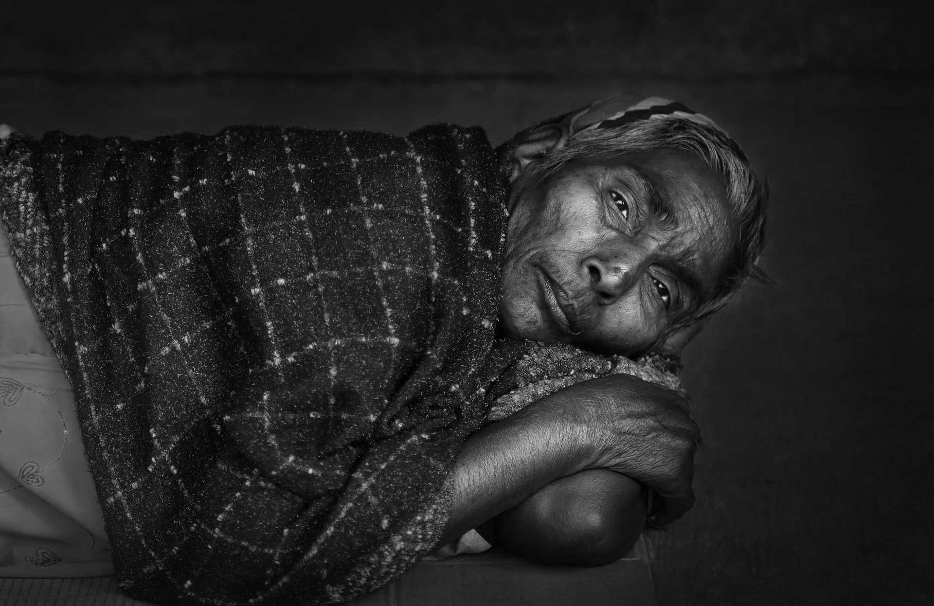Indian woman resting in urban environment