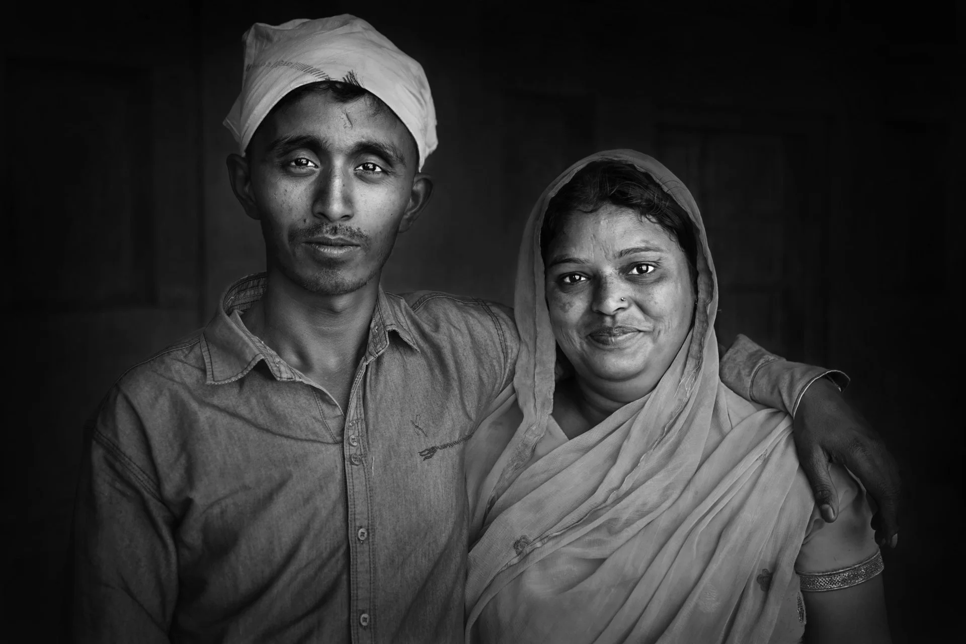 Portrait of an Indian mother and son hugging