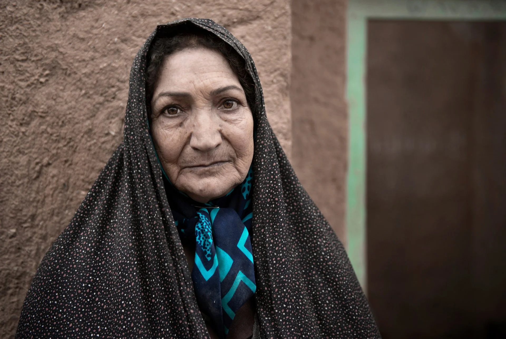 Portrait of an Iranian woman wearing traditional chador in the village