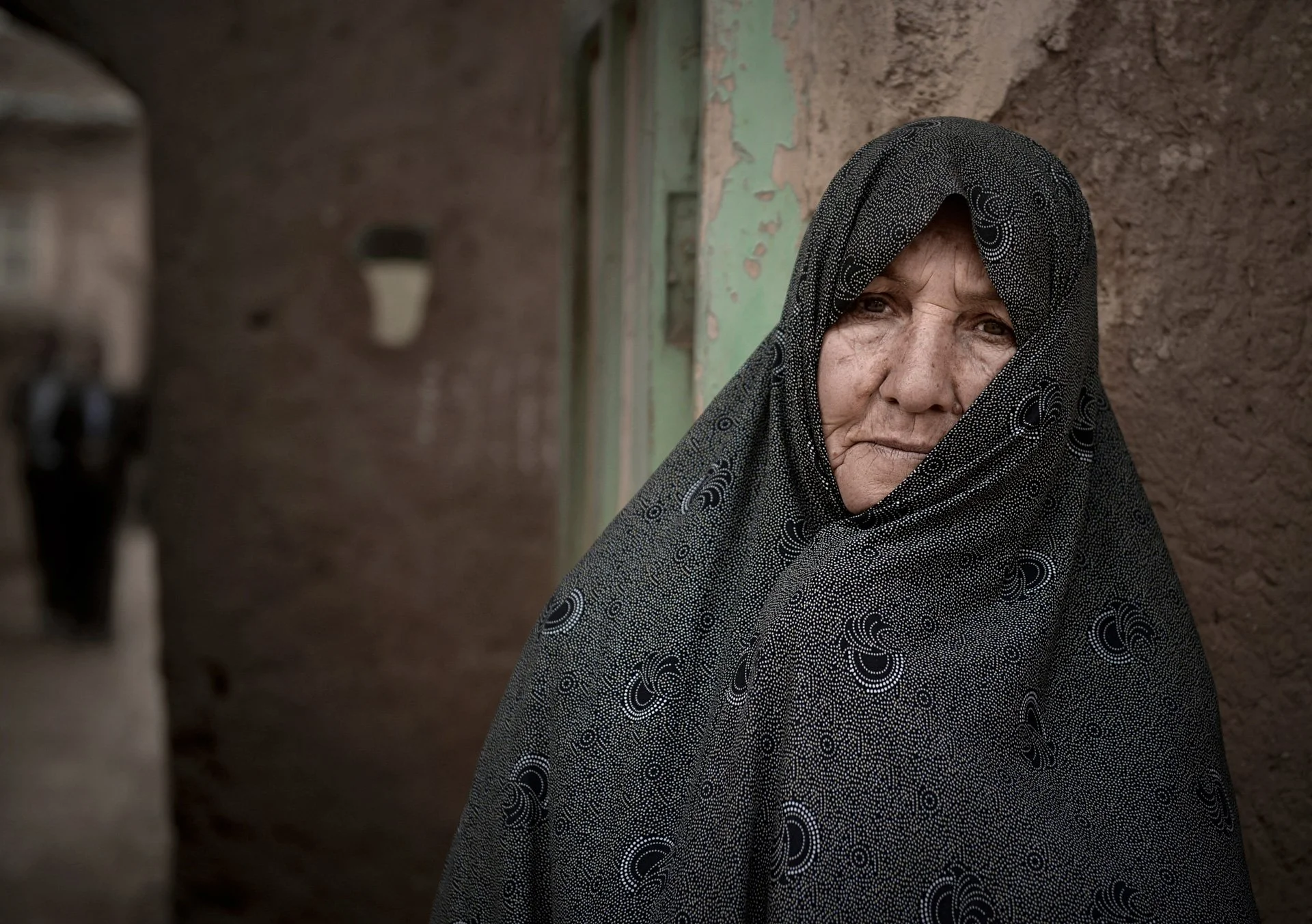 Portrait of an Iranian woman wearing traditional chador in the village
