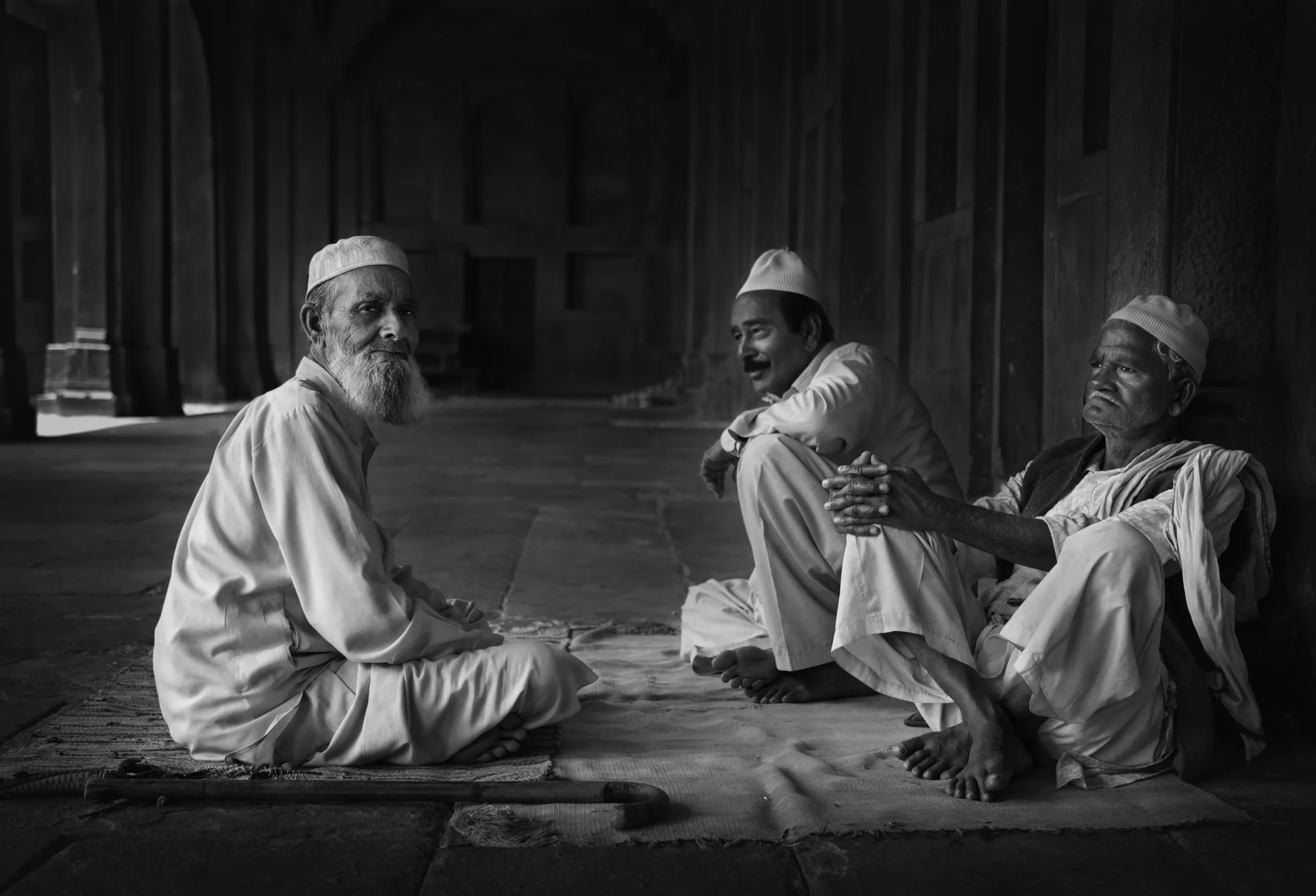 A group of Indian men sitting outdoor, India - stock photo