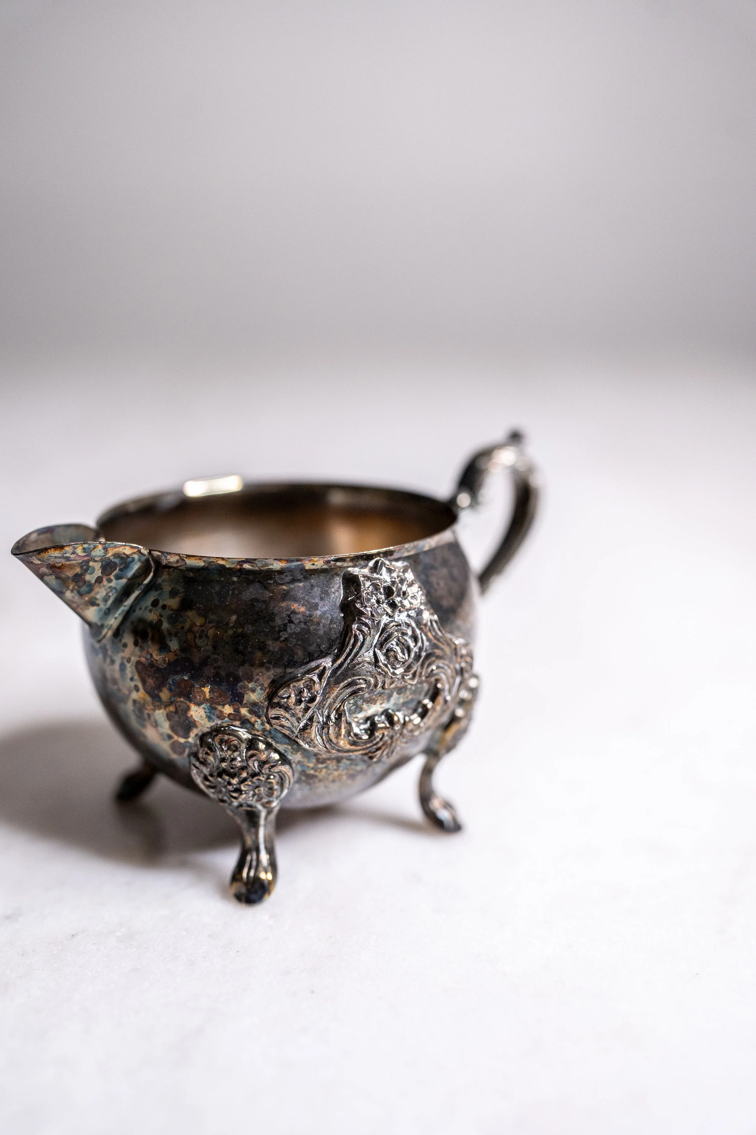 Vintage Ornate Silver-Plated 4-Footed Rose Relief Creamer Jug