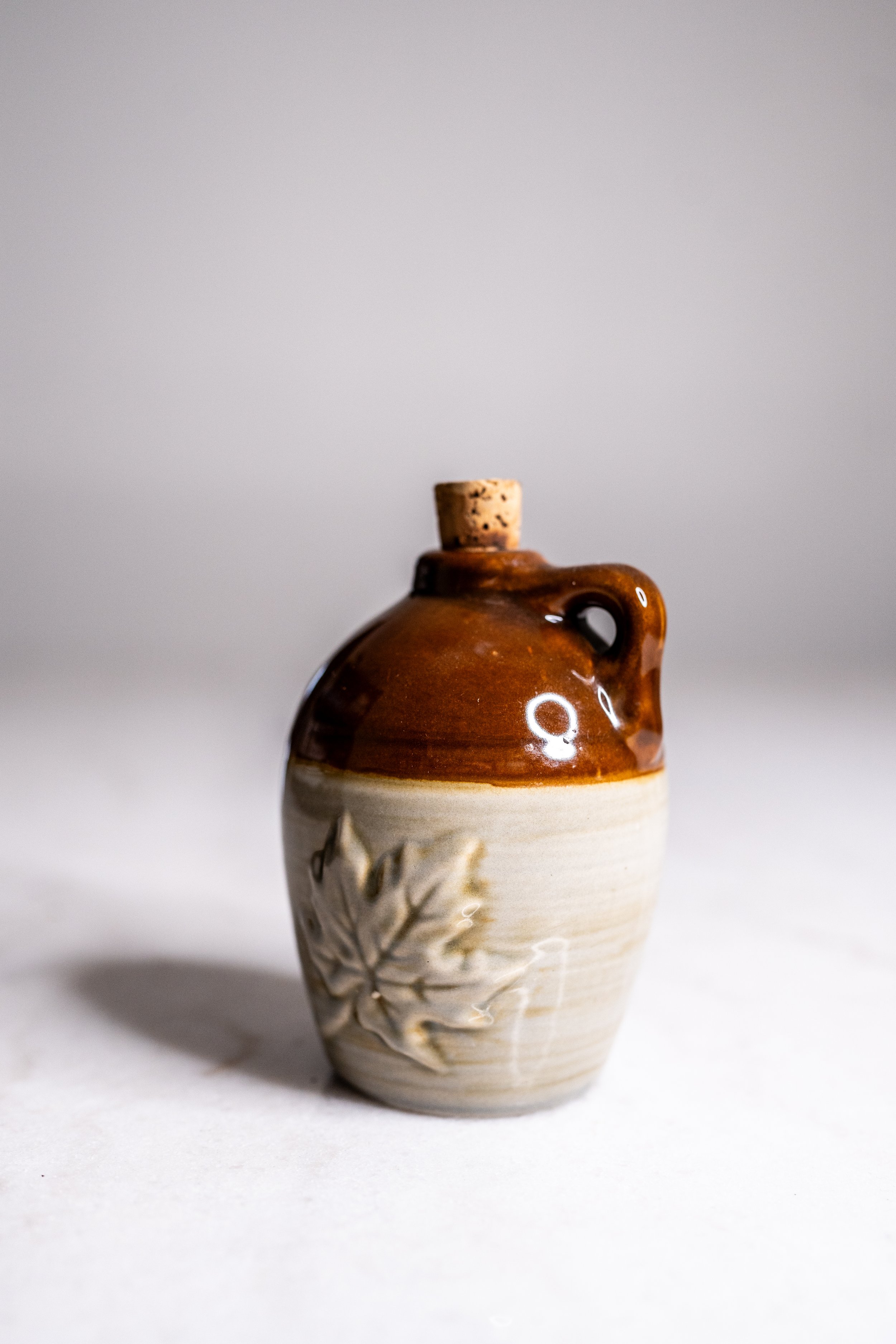 Vintage Two-Tone Miniature Stoneware Jug with Molded Maple Leaf Relief & Cork