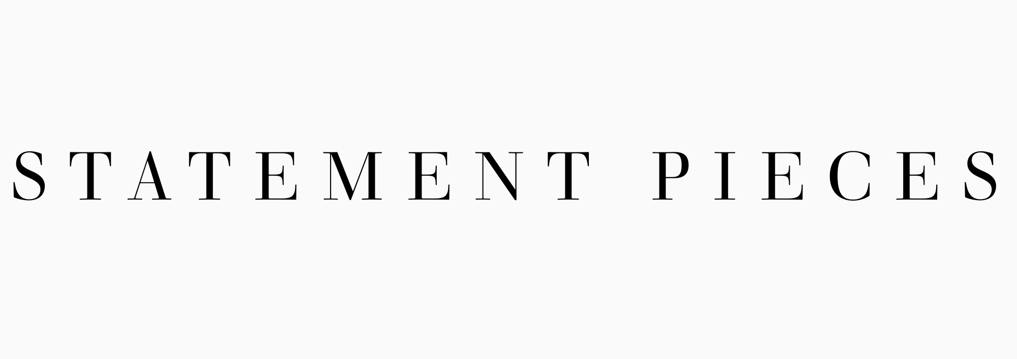 Black text on a white background reads 'STATEMENT PIECES' in a serif font.