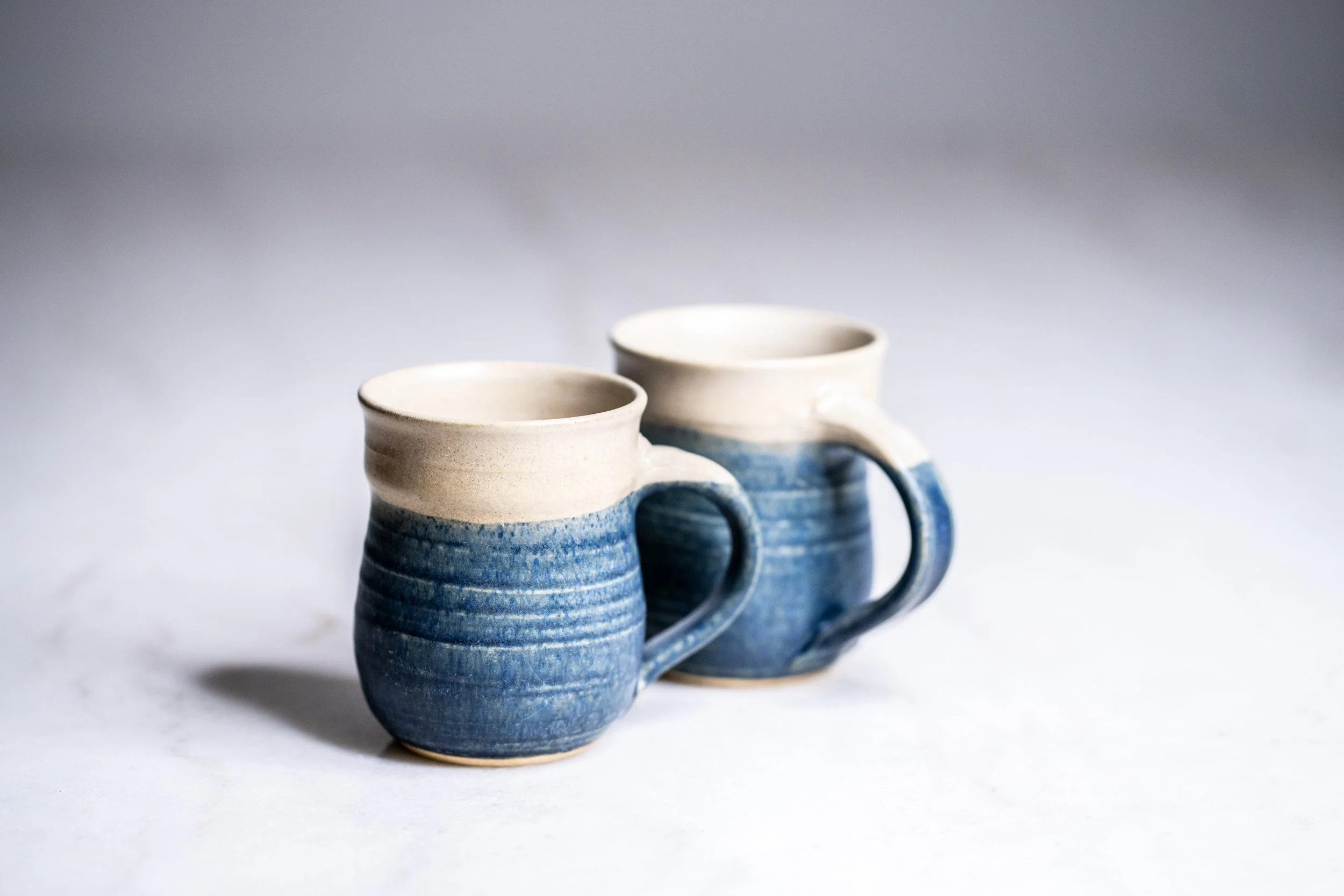Handcrafted Studio Art Pottery Coffee Mugs Pair of 2 Blue Cream Dipped Stoneware