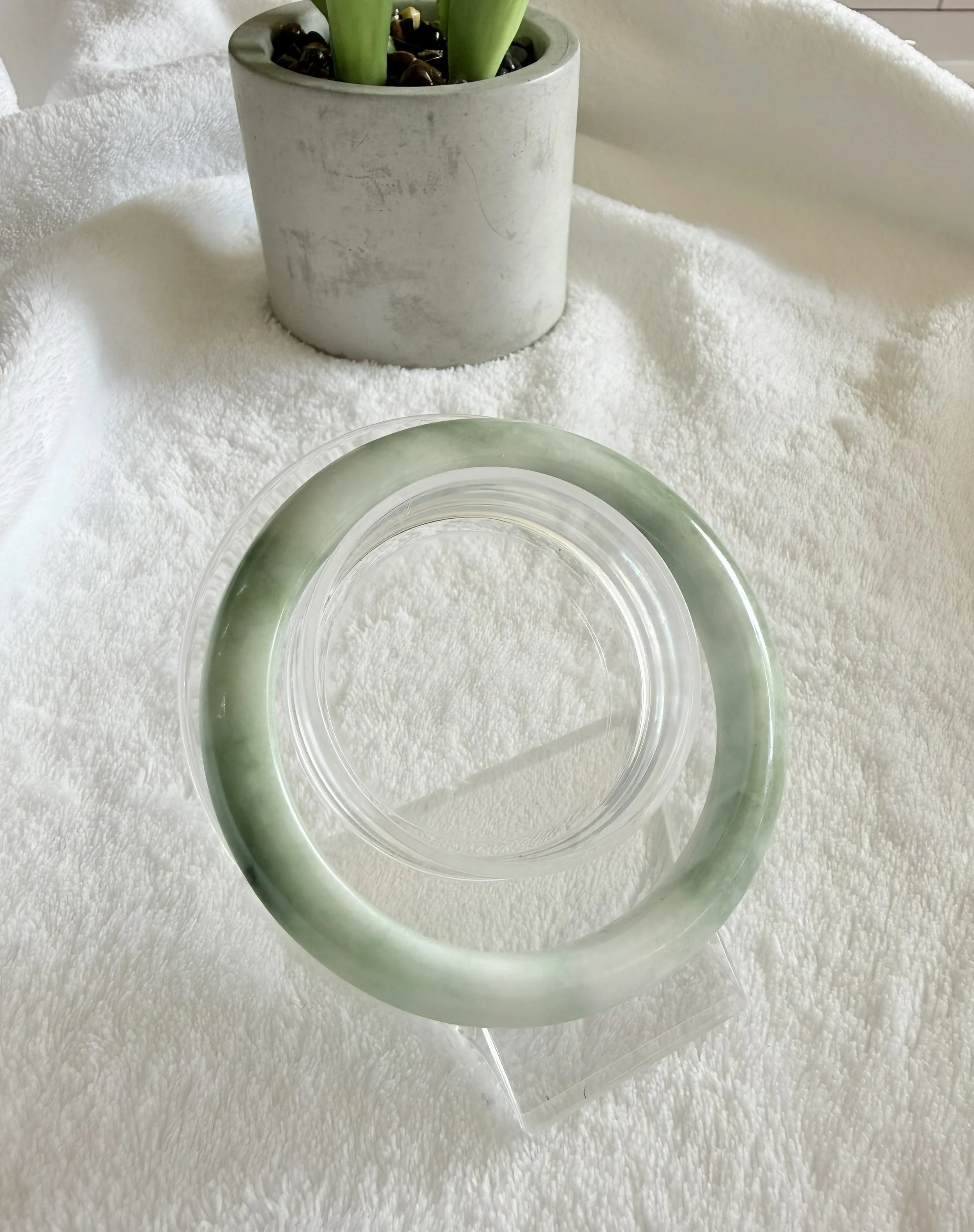Grade A Burmese Jadeite “Light green base with spicy green flower floating” bangle.