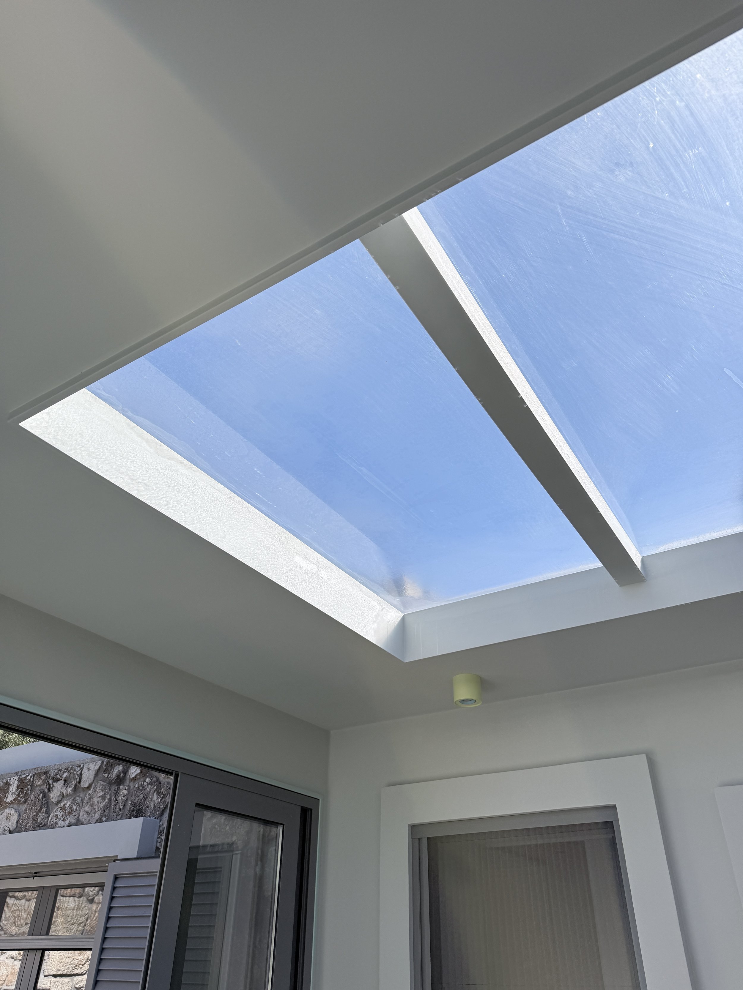 Glass Canopy Connecting Indoor and Outdoor Spaces