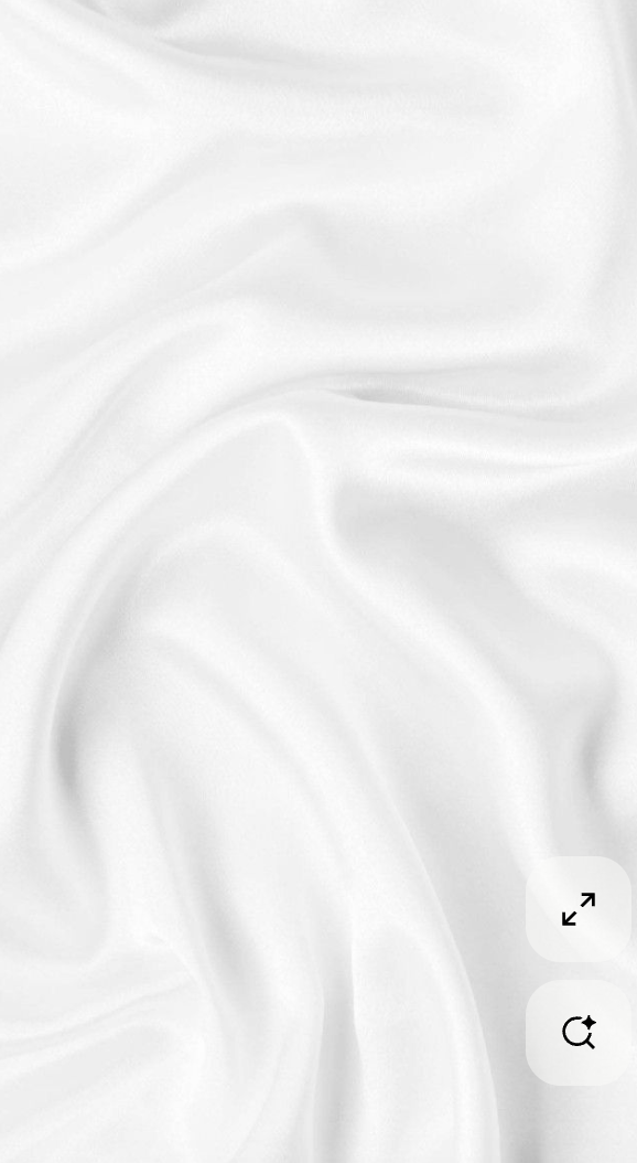 White fabric with smooth folds and gentle creases.