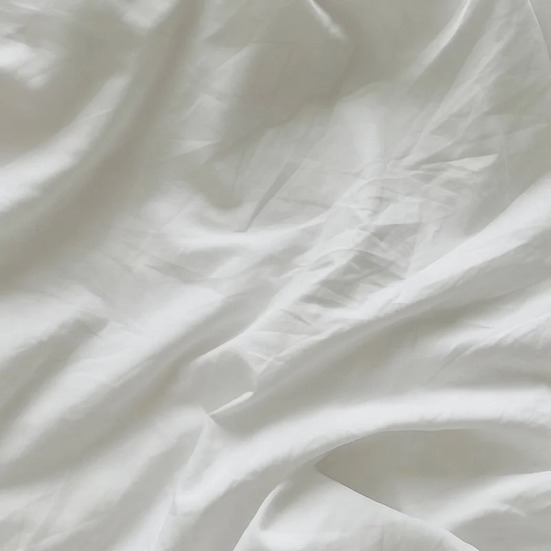 Close-up of wrinkled white fabric or material.